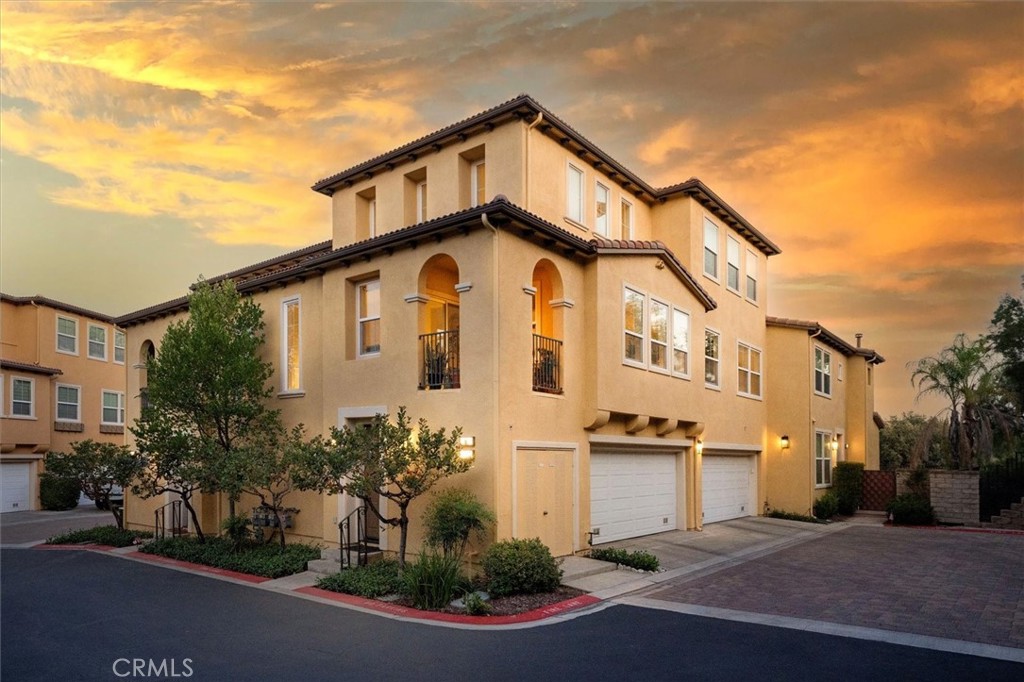 Welcome to 27017 Fairway Lane, a Modern Masterpiece in Cypress Point with NO Mello Roos. Experience contemporary living at its finest in this fully remodeled 2-bedroom, 2-bath, 1,573 sq. ft. home, showcasing exceptional craftsmanship, premium finishes, and thoughtful design throughout. Upon entry, a spacious foyer welcomes you and provides direct access to the two-car garage, which includes overhead storage and plenty of space for organization. The main living area features soaring two-story vaulted ceilings, a sleek Cosmo fireplace, and elegant custom wide plank wood flooring. The open floor plan flows effortlessly into the dining area and a chef’s kitchen designed for both style and performance. The kitchen is equipped with Miele built-in refrigerator and coffee/espresso machine, Wolf stovetop, oven, and microwave, and a Bosch built-in dishwasher. Arc Linea custom cabinetry with Sige inserts adds a sophisticated European touch, while custom oversized tile enhances the clean, modern aesthetic. The main level includes a spacious bedroom and a fully remodeled bathroom with laundry, featuring a custom one-of-a-kind wood countertop that adds warmth and natural beauty. Upstairs, the luxurious primary suite serves as a private retreat with a spa-like bathroom that includes a Produits Neptune soaking tub, separate shower, dual sinks, and a custom wood vanity and built-in storage cabinet. The walk-in closet offers built-in organization, and remote-operated blinds from The Shade Store allow effortless control of natural light. The home is ideally positioned at the end of a quiet cul-de-sac, offering privacy and proximity to community amenities including two pools, two spas, children’s pools, clubhouse, picnic and barbecue areas, tennis and pickleball courts, basketball courts, and a park with playgrounds. Located near major shopping, dining, freeway access, and highly regarded schools, this home offers the perfect balance of modern luxury, comfort, and convenience. Experience the beauty of Cypress Point living at 27017 Fairway Lane! Where design and quality meet everyday comfort.