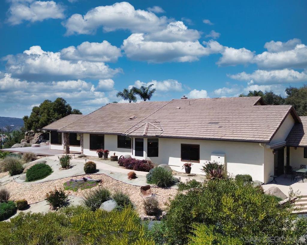 VIEJAS GRANDE ESTATES BEAUTIFUL SINGLE STORY CUSTOM HOME ON 2.5 ACRES GATED WITH OCEAN VIEW CONCRETE TILE ROOF TALL CEILINGS QUARTZ COUNTERTOPS ISLAND BAR DOUBLE OVEN ALL APPLIANCES STAY EXTRA LARGE ROOMS ATTACHED FINISHED GARAGE LOTS OF RV PARKING CIRCLE DRIVEWAY PARKING FOR 10 PLUS CARS GRAND FRONT PORCH WITH PANORAMIC VIEWS FIREPLACE OUTDOOR FIRE PIT HORSESHOE PIT AND CORNHOLE AREA LOW MAINTENANCE AND WATER LANDSCAPING 28 OWNED SOLAR PANELS INDOOR LAUNDRY SELLER JUST RESEALED THE DRIVEWAY.