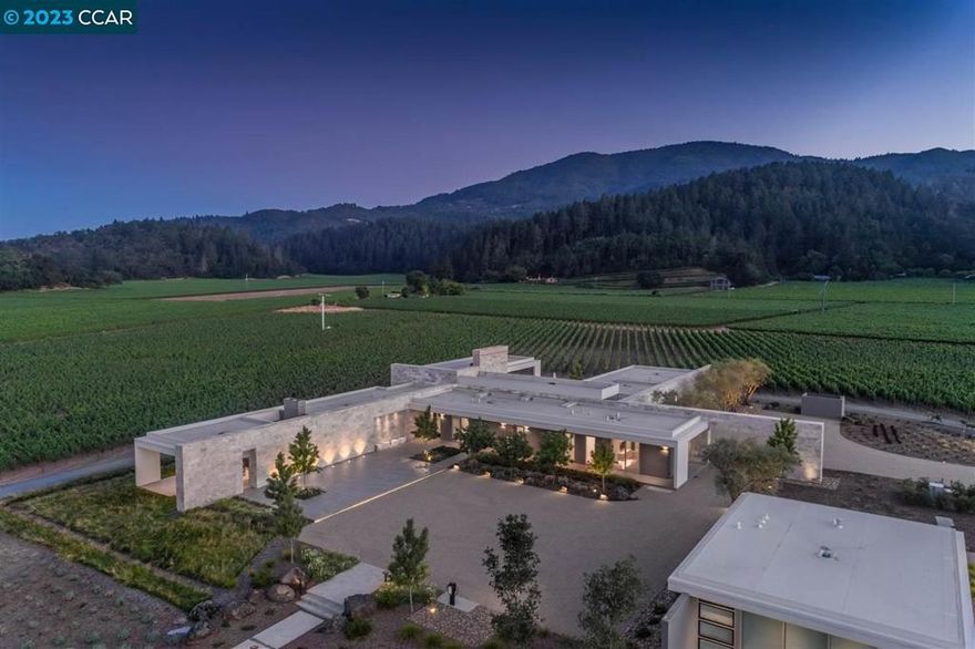 Stunning 20 acre gated vineyard estate. This striking compound features two contemporary residences (14,000 SF+ under roof) and a detached wellness pavilion. State-of-the-art finishes and countless amenities throughout cultivate an unparalleled modern wine country lifestyle. Amenities include a sport court, infinity pool/spa, putting green, and a secondary lap pool, as well as a grove of +25 year old olive trees from which a buyer can harvest and press its own estate olive oil. Mountain and vineyard views in every direction. The property includes a 14 acre vineyard that is leased, managed and maintained by a third party at no expense to the buyer. An extraordinary Napa Valley property.