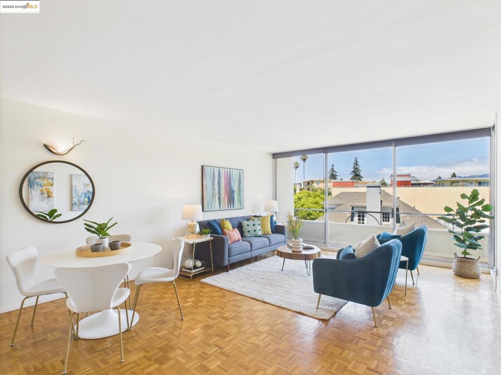Stylish mid-century living in the heart of Adams Point! Unit 503 in the coveted Van Buren Tower offers a rare blend of timeless design and thoughtful updates, just blocks from Lake Merritt. This light-filled 1BD/1BA condo features white-oak parquet flooring throughout, floor-to-ceiling windows, and peaceful views of the Oakland/Berkeley Hills. The kitchen boasts new stainless steel appliances, warm butcher block counters, a breakfast bar, and generous cabinetry — perfect for everyday cooking or entertaining. The spacious bedroom includes upgraded closet doors and private balcony access, ideal for morning coffee or evening unwinding. Enjoy modern conveniences like coded elevator access, gated garage parking, EV charging, app-enabled laundry, locked storage, and secure bike parking. Pet-friendly, too! Just minutes from Whole Foods, Trader Joe’s, Grand Lake Kitchen, Lake Chalet, the farmers market, and local transit options including BART and Transbay buses. A true gem in one of Oakland’s most walkable, connected, and vibrant neighborhoods. Open Saturday and Sunday 2:00 - 4:30pm!