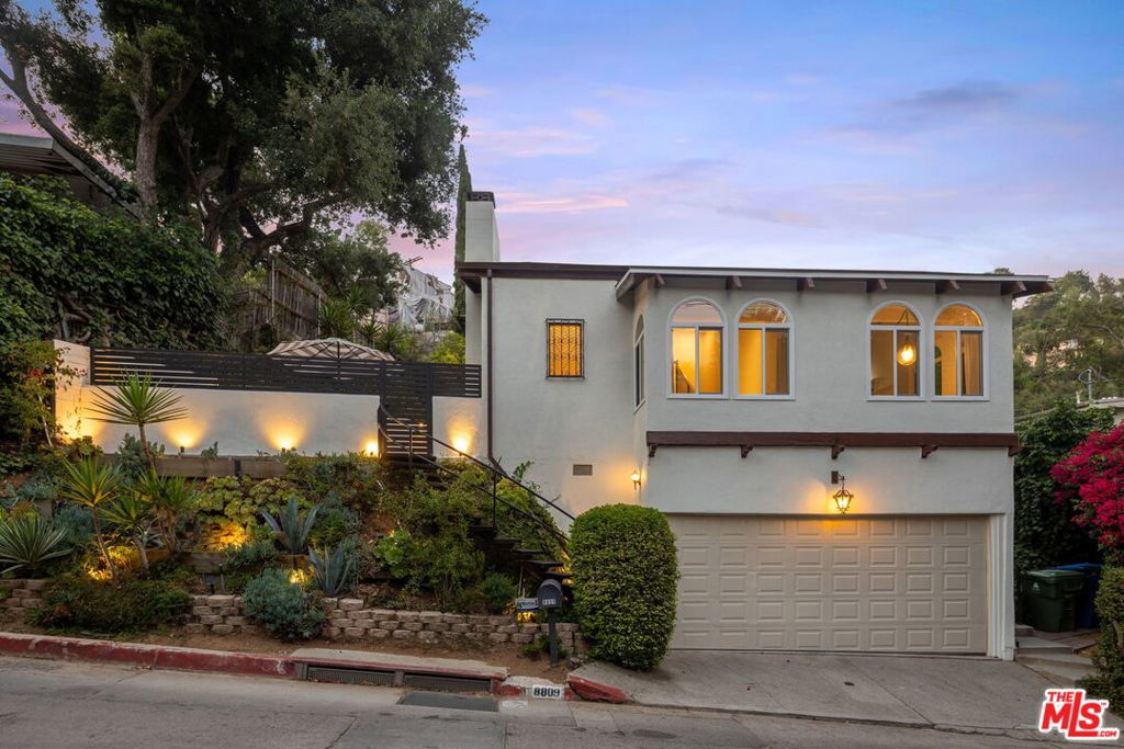 Nested on an outstanding tree-lined street in the heart of the Hollywood Hills, this newly updated Spanish style home is destined to elevate your lifestyle. Beautiful landscaping complements a gated front patio that is large enough for outdoor entertaining, setting the scene for memorable evening gatherings. New hard wood floors and vaulted wood ceilings embellish the spacious interior, where new windows ands fresh paint and central heating and air-conditioning are featured. A brand-new kitchen transitions seamlessly to a dining area, and the lower level presents an attached two-car garage. Spend quiet mornings relaxing on the rear deck, or head up to the Mulholland Tennis Club for an invigorating round or two. Located within the highly coveted Wonderland School District, this turnkey home is close to nightlife along the Sunset Strip, fashionable dining and shopping in West Hollywood and Beverly Hills, Laurel Canyon's dog park, and miles of hiking trails for all skill levels. Disney, Universal and Warner Bros. studios are just over the hill. Schedule your private, in-person tour today and experience the ultimate in Hollywood Hills living. All potential tenants must have high credit scores.