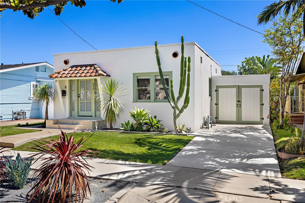 Welcome to 630 W Wilshire - a beautifully remodeled 2 bedroom, 2 bathroom home that perfectly blends quality craftsmanship and modern comfort in an unbeatable location. Every inch of this home has been thoughtfully updated, including new plumbing, a 200-amp electrical panel with solar, a new roof, tankless water heater, and a high-efficiency mini split AC system. Beautiful White Oak hardwood floors run throughout the open-concept living space. The designer kitchen features gorgeous stone countertops, a stylish butcher block island, and ample cabinetry - perfect for cooking and entertaining. Both bathrooms have been remodeled with intricate tile flooring and modern vanities. The primary suite is a private retreat with dual sinks and a walk-in shower. Step outside into a little backyard paradise - complete with covered deck for lounging or dining al fresco and a spacious grassy area for play or pets. The generous lot offers space for RV parking or potential ADU plus a one-car garage for added convenience. Located within walking distance of the restaurants, shops and nightlife of Downtown Fullerton, this home offers the best of urban living in a peaceful, tree-lined neighborhood setting. Don’t miss this rare opportunity to own a turn-key home in one of Fullerton’s most desirable locations!