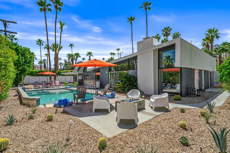 Now available for January-February 2026! Welcome to Palm Springs Paradise, a stunning vacation rental nestled in the heart of Palm Springs' iconic Twin Palms neighborhood. Immerse yourself in the golden age of design with this quintessential mid-century modern home, a testament to the genius of famed architects Palmer & Krisel and the craftsmanship of the Alexander Construction Company.Step through a private courtyard entry into your own desert paradise. A double-door entrance leads to a stylish interior. Expansive walls of glass connect the indoors to the spectacular outdoor entertaining area, blurring the lines between home and nature. The gourmet kitchen with bar seating is perfect for casual dining, while the gorgeous, spacious living room invites you to unwind by the fireplace beneath vaulted ceilings, all while enjoying breathtaking views of the backyard.The main bedroom is a true sanctuary, offering sweeping mountain views, a contemporary private bath, and exclusive access to a serene outdoor shower. Two additional guest bedrooms, plus an attached casita, provide ample space for everyone to relax in comfort. Throughout the home, you'll find polished concrete floors, soaring ceilings, skylights, and clerestory windows--all working together to create a light-filled space that embodies the vibrant Palm Springs modern lifestyle.Yucca Place isn't just a place to stay--it's an experience. Come and discover your own slice of heaven in the desert.