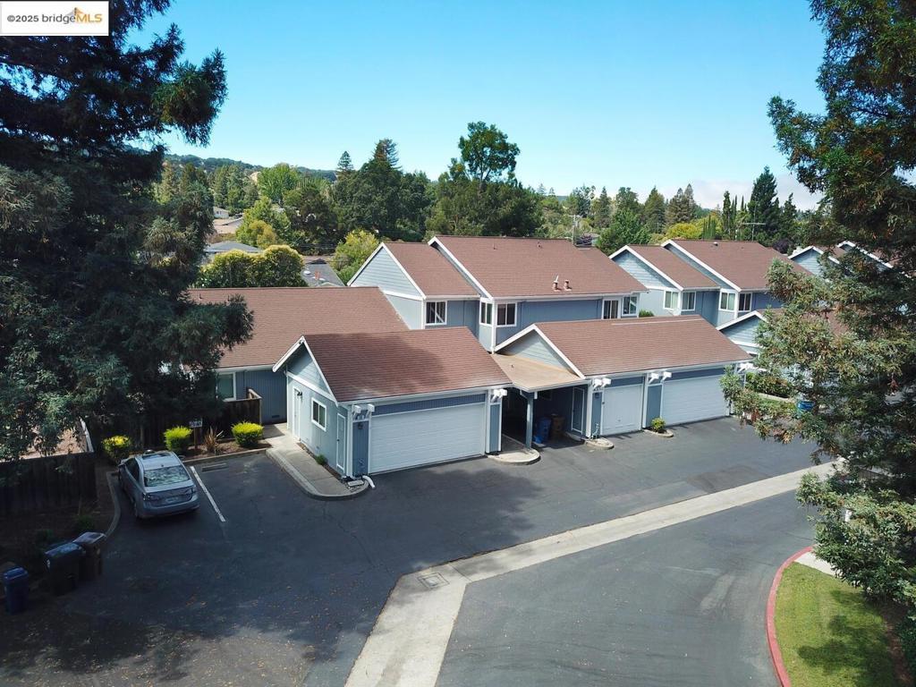 Open Sunday, 8/17 from 1-4 p.m. and Tuesday, 8/19 from 10am-1pm. Charming end-unit in Donegal Place on the Pleasant Hill border! This single-story 2BD/2BA home (~1,285 sq ft) offers vaulted ceilings in the living room & primary suite, cozy fireplace, energy-efficient dual-pane windows/doors, and laminate flooring throughout. Kitchen features tiled counters, dual stainless sink, stainless steel fridge, dishwasher & electric oven/stove. Dining area with ceiling fan/light & built-in bookshelves. Primary bath boasts dual sink vanity & step-in shower. Includes laundry room with washer/dryer and 2-car garage with interior access. One of the largest lots in complex with deck for entertaining and garden/play area. Close to shopping, transit, and the charm of Martinez & Pleasant Hill.