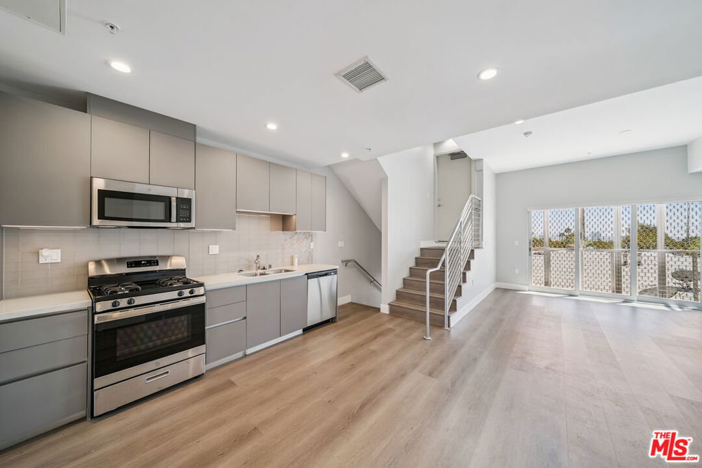 Every 2-bedroom comes with its own Rofftop Backyard!!! 2-Bedroom Tandem Parking Included. Gated building. In unit Laundry. Balcony. BRAND New Buuilding. Welcome to this just-finished, contemporary-modern 2bed, 2.5bath residence located in the heart of prime West Hollywood. Step into a beautifully designed unit where natural light floods through oversized windows, highlighting the sleek modern wood flooring and open-concept layout. The expansive living room flows seamlessly into a stunning kitchen featuring quartz countertops, modern cabinetry, and stainless steel appliancesincluding a dishwasher.Recessed lighting throughout enhances the clean, modern design, while the in-unit washer and dryer offer ultimate convenience. Both bedrooms are spacious with ample hanging and storage space. The bathrooms feature elegant modern finishes, including a beautifully tiled shower and excellent lighting.Additional perks include generous pantry and closet storage, plus covered parking. Be among the first to live in this brand-new buildingschedule a tour before these exceptional units are gone!