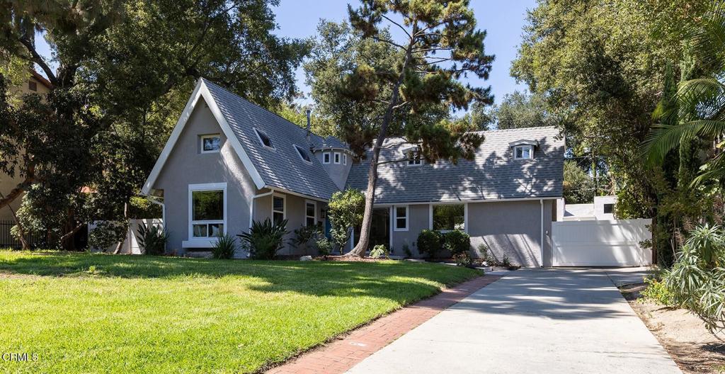Dramatic English Tudor home on an oversized lot in Glendale's prestigious Verdugo Woodlands neighborhood! Plentiful architectural windows throughout the home allow natural light to shine through, showcasing its timeless charm and modern amenities. Featuring a spacious formal living room with vaulted ceilings and fireplace, a gourmet kitchen with custom cabinetry, stainless steel appliances, quartz countertops, plus an open-concept dining area / family room with French doors leading to a private backyard oasis. The main floor primary en suite is a true retreat with its private bathroom bathed in sunlight. Two spacious bedrooms upstairs share a full bathroom and feature extra space and privacy. Outside, enjoy a resort style backyard with patio area, pool and spa, detached two car garage with gated entry and ample extra parking. Located in a coveted neighborhood, this home offers exceptional curb appeal, timeliness updates, and a seamless indoor-outdoor lifestyle.