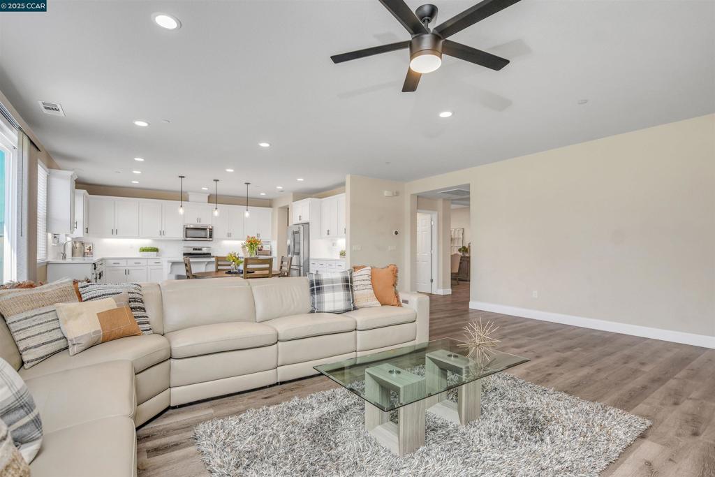 PRICE CHANGE! 5420 Promontory Way in Antioch, a stunning single-story home built just 2 years ago, featuring 4 bedrooms, 3.5 bathrooms, and nearly 3,000 sq ft of living space and a 3 car garage. Nestled on a spacious lot of just under 11,000 sq ft, this home offers a luxurious yet comfortable living environment. As you enter, you're welcomed by a grand entryway leading into a beautifully designed open floor plan that integrates living, dining, and family areas—perfect for both quiet family nights and lively gatherings. The kitchen is equipped with modern cabinetry and a large center island, providing ample space for meal preparation and casual dining. Each bedroom is generously sized, with the primary suite offering a serene retreat complete with a spacious ensuite bathroom and a large walk-in closet. The home features numerous builder upgrades including LVP floors throughout the main areas, elevated ceilings, paid solar panels and modern home automation features to enhance your living experience. The expansive backyard offers a vast area ready to be your personal haven, ideal for outdoor activities or simply enjoying the tranquility of your surroundings. This home combines style, comfort, and very close to the freeways and Bart!