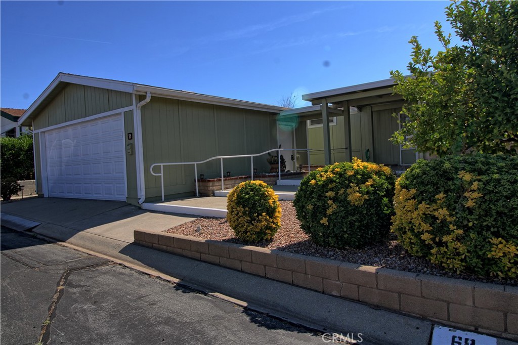 Beautiful Banning Estates corner lot for 55+ living. This spacious manufactured home has 3 bedrooms and 2 full bathrooms. Large living/dining room with raised hearth fireplace and built in shelving. Kitchen with a front porch view and open to eating area. Indoor laundry room with extra storage. Plank flooring throughout. Front and backyard patio area with easy care landscaping and a detached 2 car garage. Beautiful common area grounds includes club house and swimming pool. Gardener included in the rent.