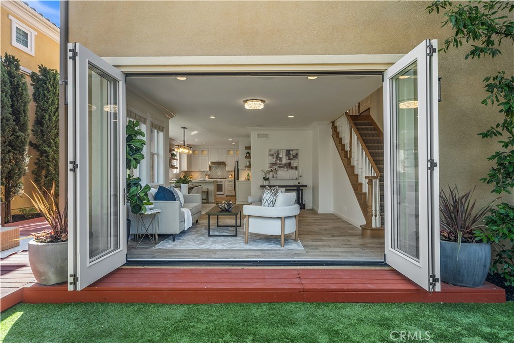 CUSTOMIZED LUXURY SINGLE-FAMILY HOME DESIGNED FOR SEAMLESS INDOOR–OUTDOOR LIVING!
This mountain-view home with 5 bedrooms (presently configured as 4 bedrooms plus a large bonus room) offers approximately 2,430 sq. ft. of stylish and functional living space. Toll Brothers craftsmanship meets the coveted Baker Ranch lifestyle in this single-family home, set on a large corner lot, featuring low property taxes and no Mello Roos.
A two-story foyer welcomes you into the light-filled interior, and 12' Andersen folding doors open to a backyard with mountain views, creating an indoor–outdoor California-style experience. The first-floor bedroom and full guest bathroom easily convert into a private en-suite with the added custom barn door, making it ideal for guests or extended family when needed (click on the 3D tour to see more).
The kitchen showcases ceiling-height custom cabinetry with soft-close drawers and doors, slide-out pantry shelves, a full-height designer tile backsplash, farmhouse sink with touchless faucet, quartz counters, under-cabinet lighting, and direct access to the garage. The spacious Great Room offers an integrated surround sound system so you can watch movies and sports games from the backyard.
Upstairs, the luxury primary suite offers a spa-inspired bath with a separate soaking tub and shower, dual showerheads (one being a rain head), floating cabinetry, quartz counters, a frameless glass enclosure, floor-to-ceiling tile, and a custom-organized walk-in closet. Secondary bedrooms feature custom closet organizers, and the upstairs laundry room includes a sink and cabinetry.
Additional highlights include crown molding, wood-look tile, LVP flooring, epoxy garage floor, EV charger, leased 2.4 kW solar system, tankless water heater, on-demand hot water, and more. Enjoy close proximity to The Grove Clubhouse, Passage Park, Promenade Park, and Baker Ranch Community Park. Nearby amenities include basketball and pickleball courts, volleyball, dog parks, and over 10 acres of scenic trails connecting to Serrano Creek.
This prime location also provides convenient access to Foothill Ranch Towne Centre, the 241 and 133 Toll Roads, the 91, 5, and 405 freeways, as well as nearby airports including JSX, John Wayne, and LAX. Shopping, dining, and beaches are just minutes away, with Irvine Spectrum, Fashion Island, South Coast Plaza, Newport and Laguna Beach, Dana Point Harbor, and the world-class surf of San Clemente all within easy reach.