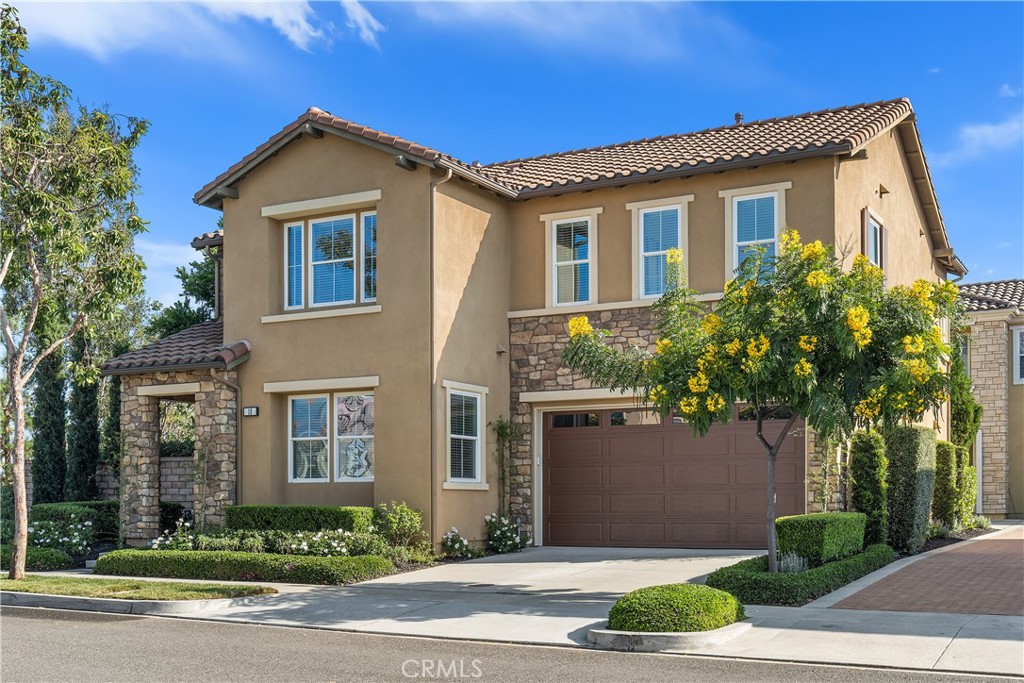 CUSTOMIZED LUXURY SINGLE FAMILY HOME DESIGNED FOR SEAMLESS INDOOR–OUTDOOR LIVING! 5 bedrooms (presently configured as 4 bedrooms and a large bonus room) awaits you!
Toll Brothers craftsmanship meets the coveted Baker Ranch lifestyle in this elegant single-family home, featuring low property taxes, no Mello Roos. five bedrooms. A soaring two-story foyer welcomes you into the light-filled interior. A first-floor bedroom with adjacent full bath, enhanced by a hallway barn door, creates a private en suite retreat, perfect for guests or extended family (click on 3D tour to see). The kitchen features ceiling height custom cabinetry with soft-close drawers and doors, slide-out pantry shelves, full-height tile backsplash, farmhouse sink with touchless faucet, quartz counters, and under-cabinet lighting. The spacious Great Room offers an integrated surround sound system, and 12' Andersen folding doors open to create seamless indoor-outdoor living to the backyard, which includes synthetic turf, a custom redwood wraparound deck, mature cypress trees, and low-maintenance landscaping. Upstairs, the luxury primary suite presents a spa-inspired bath with a separate soaking tub and shower, floating cabinetry, quartz counters, a frameless glass shower enclosure, floor-to-ceiling tile, and a custom-organized walk-in closet. Secondary bedrooms also feature custom closet organizers, and the laundry room includes a sink and cabinetry. Additional features include crown molding, wood-look tile, LVP flooring, epoxy garage floor, EV charger, leased 2.4 kW solar system, tankless water heater, on-demand hot water and more. Enjoy close proximity to The Grove Clubhouse, Passage Park, Promenade Park, and Baker Ranch Community Park. Nearby amenities include basketball and pickleball courts, volleyball, dog parks, and over 10 acres of scenic trails connecting to Serrano Creek. This prime location also provides convenient access to Foothill Ranch Towne Centre, the 241 and 133 Toll Roads, the 91, 5, and 405 freeways, as well as airports including JSX, John Wayne, and LAX. Shopping, dining, and beaches are just minutes away, with Irvine Spectrum, Fashion Island, South Coast Plaza, Newport and Laguna Beach, Dana Point Harbor, and the world-class surf of San Clemente all within easy reach.