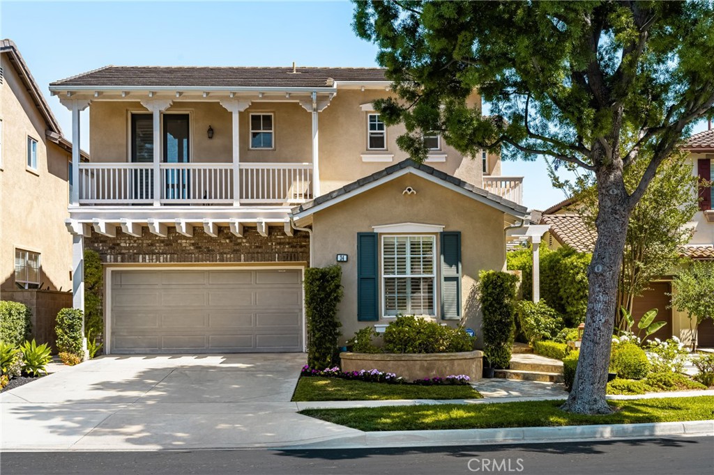 Gorgeous Home in the highly sought-after 24-hour Guard-Gated community of Northpark! Perfectly situated on a quiet cul-de-sac, this impressive home features 4 bedrooms, 2.5 bathrooms, 3-car garage, and an oversized backyard, all on a ~5,000 sq ft lot! As you step inside, you're greeted by an open and airy floorplan with soaring ceilings and rich hardwood flooring. To the left, the light-filled Living Room offers a warm and welcoming space to relax. Continue past the convenient downstairs powder room, and you’ll enter the Formal Dining Room, where French doors open to a charming courtyard, perfect for cozy outdoor meals. The heart of the home is the Chef-inspired Kitchen, complete with crisp white cabinetry, granite countertops, a five-burner cooktop, double ovens, walk-in pantry, and a spacious center island, ideal for cooking and entertaining. The Open Kitchen overlooks the Gorgeous Family Room which features built-in media cabinets, a cozy fireplace and direct access to your PRIVATE backyard oasis, thoughtfully designed with stone pavers, a patio trellis, lush greenery, and mature trees. This expansive yard offers plenty of room for outdoor dining, entertaining, play, and relaxation. Upstairs, the sunlit staircase leads you to 4 spacious bedrooms, including a luxurious Primary Suite with ample room for a king-sized bed and a sitting area. You will love the spa-like en-suite bathroom with dual vanities, a soaking tub, separate shower, and 3 large walk-in closets. Down the hall, you’ll find 3 additional bedrooms. 2 bedrooms have direct access to private balconies and all share a well-appointed bathroom with dual sinks. The upstairs Laundry room with sink adds everyday convenience. Other highlights include a 3-car garage (2-car tandem + 1), tankless water heater, newer A/C, and ample storage throughout. With Low HOA and Mello Roos, residents enjoy access to resort-style amenities including five pools, tennis courts, walking trails, and direct access to Hicks Canyon Elementary School. You're just a short walk to Orchard Hills and Northpark Shopping Centers, with Pavilions, H Mart, CVS, Wells Fargo, and numerous dining options nearby. Zoned for award-winning Tustin Unified Schools, this home is a rare opportunity not to be missed!