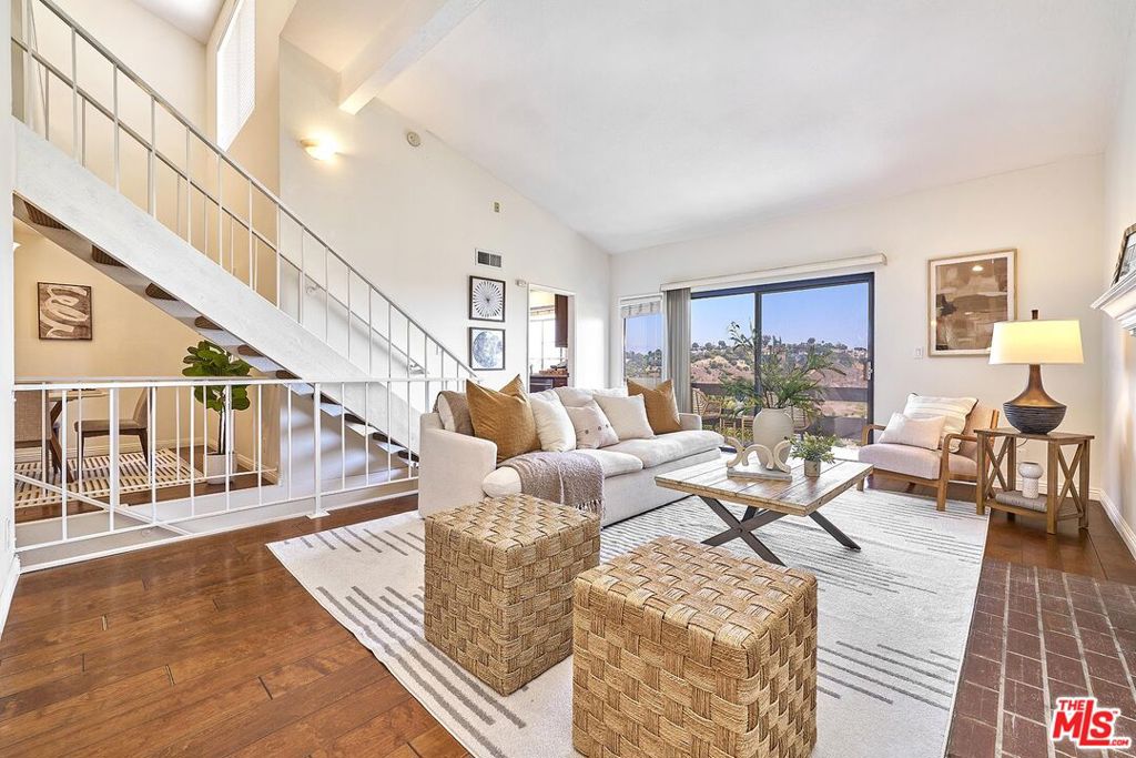 VIEW, VIEW, VIEW!! A rare opportunity to own a tri-level beautifully remodeled townhome nestled in the highly desirable Fremont Villas community in Monterey Hills, Los Angeles. Built in 1981, this graceful residence spans 1,578 sqft and features 3 bedrooms and 3 full bathrooms, while sharing only one wall imparting the privacy and feel of a single-family home. Gorgeous end unit beautifully upgraded townhome w/ 2 en-suites and a loft in Via Marisol with AMAZING ENDLESS VIEWS!!! Main level living room with soaring high ceiling, fireplace, wet bar, formal dining room, powder bath, and balcony w/ view overlooking beautiful south Pasadena hills which is called LA's hidden treasure by Los Angeles Magazine! Lower level has 2 master suites, balcony. Upper level is a good size loft with higher ceiling. Beautiful wood flooring thru out, upgraded big size kitchen w/ stainless steel appliances including a fridge, remodeled bathroom w/ walk-in shower & vanity. Attached 2 car side-by-side garage w/ shelves, cabinets, and washer/dryer. Community club house, pool and spa. Tastefully remodeled, the home impresses with a stylish, renovated kitchen, a new central AC system, and an enlarged laundry roomcrafted for both comfort and convenience. Step into the light-filled living area, where hardwood floors, recessed lighting, and a sleek modern gas fireplace invite relaxation. The open floor plan flows seamlessly to a serene balcony offering scenic views of the rolling South Pasadena hills often dubbed "L.A.'s hidden treasure" by Los Angeles Magazine. Enjoy the ease and accessibility of a 2-car attached garage, and the peace of mind that comes with central cooling and efficient layout. Set in tranquil Monterey Hills, yet just a short drive from DTLA, USC Keck Medical Center, South Pasadena, Pasadena, and vibrant NELA neighborhoods, this townhome balances the calm of nature with urban convenience. For outdoor lovers, Ernest E. Debs Park with hiking trails, hilltop panoramas, and a peaceful lake is within reach. Approximately 6.89 acres of lush community grounds provide a peaceful backdrop and a true hidden gem within Los Angeles.