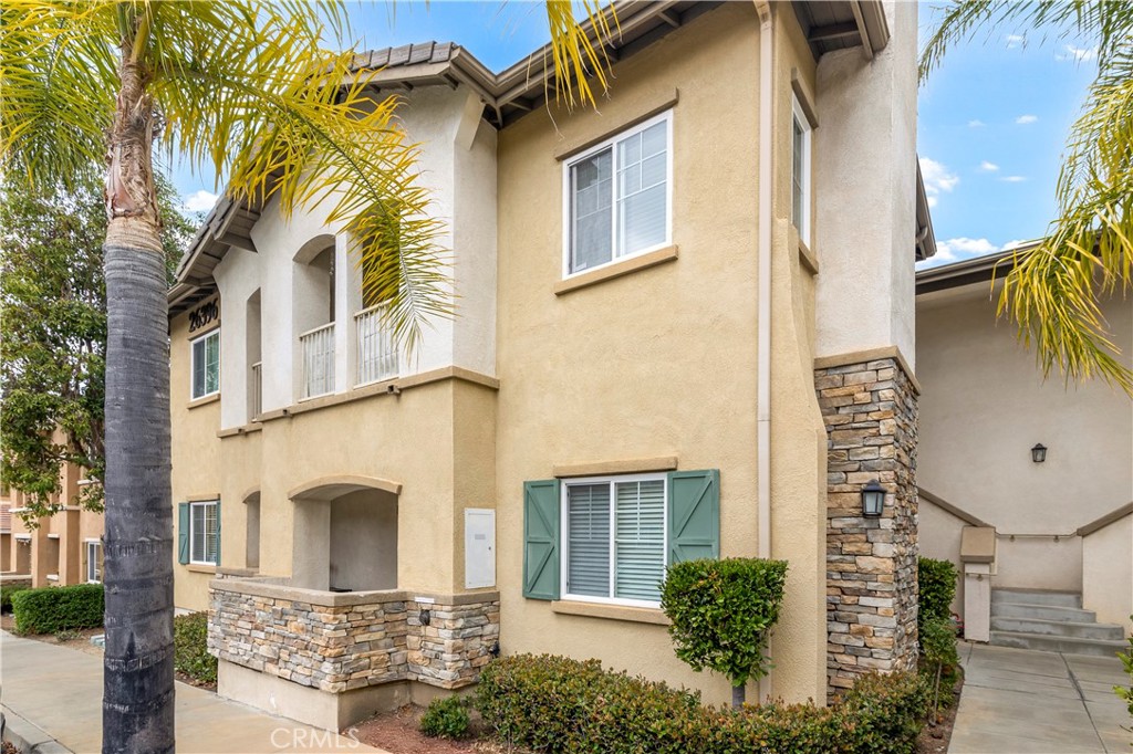 VA Approved! FHA SPOT APPROVAL ELIGIBLE. Brand New AC Unit Just Installed! Welcome to this charming Ground-level condo in the highly sought-after gated community of Verona. This beautifully maintained 2-bedroom, 2-bathroom home offers 890 square feet of comfortable living space along with a detached 1-car garage for added convenience. Upon entering, you’ll find a spacious family room featuring a cozy gas fireplace and ceiling fan, creating the perfect space to relax. The adjoining dining area provides direct access to a private patio, ideal for enjoying your morning coffee or unwinding in the evening. The well-appointed kitchen boasts ample cabinet space, a breakfast counter, and sleek stainless steel appliances, making it both functional and stylish. Down the hall, a stackable washer/dryer hookup is conveniently tucked away in a closet. The primary suite features plush carpeting, a walk-in closet, and a private en-suite bathroom with a shower and single-sink vanity. A secondary bedroom and an additional full bathroom provide extra flexibility, whether for guests, a home office, or additional living space. As a resident of Verona, you’ll have access to fantastic community amenities, including a fitness center, sparkling pool, and relaxing spa, offering resort-style living right at home. This prime location is just minutes from Buchanan Elementary, shopping, dining, and has easy access to the 215 and 15 freeways. Don’t miss this fantastic opportunity—schedule your showing today and make this beautiful condo your new home!