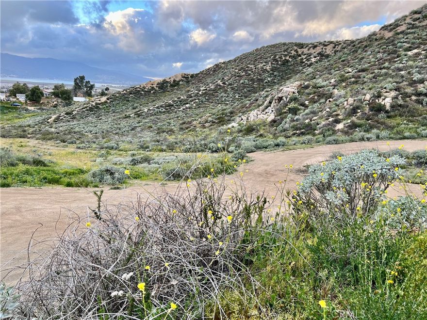 LAND WITH A VIEW OF THE LAKE AND CITY LIGHTS!  LAND HAS BEEN SURVEYED AND PERC TESTED!!!! INCREDIABLE OPPORTUNITY! USABLE LAND, LOCATION! LOCATION! AS WILDOMAR CONTINUES TO GROW! - Build your Dream on 1.97 Arce's!  Property has been surveyed and perk test was successful. Please feel free to contact City of Wildomar for more information regarding this amazing land. The property has electric on Sheri Ln and City Water near by. Easy access to the 15 fwy, close to shopping centers and hospitals. Approximately 30 minutes to Temecula Wine Country and 20 minutes to Old Town Temecula. Close to Menifee, Canyon Lake, Murrieta and Temecula. Great Investment!