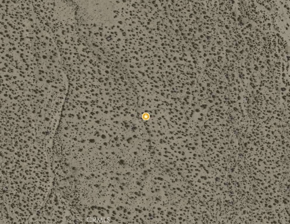 Almost 2.5 acres of untouched desert beauty in Palmdale’s rapidly growing Antelope Valley. This blank canvas offers sweeping desert views and wide-open skies. The lot currently has no direct road access and no utilities on site—an ideal opportunity for buyers seeking privacy and self-sufficiency. Zoning is rural/agricultural (check with L.A. County for specific uses). Buyer to investigate and satisfy themselves regarding access, utilities, and all permitting requirements. Create your own vision on this serene slice of desert paradise today.