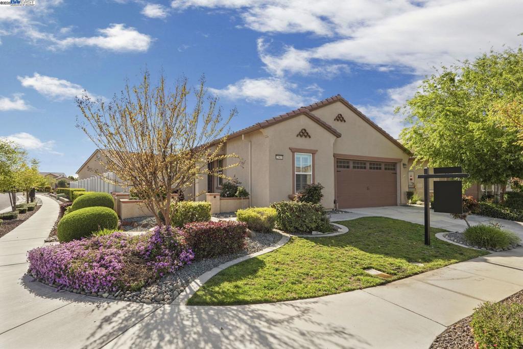 Welcome to your dream home in Woodbridge, Manteca's vibrant 55 and over community! This move-in-ready gem offers 2 cozy bedrooms and 2 pristine bathrooms across 1,474 square feet of contemporary living space. Enjoy the seamless open layout that flows from the living area to the heart of the home—the kitchen. The spacious attached garage makes storage a breeze, while the central AC and heating ensure year-round comfort. Step outside to your private oasis with a lush front yard, a fenced back yard perfect for pets, and a barbecue area ready for gatherings. The garden invites your green thumb, and the convenient laundry room adds an extra touch of functionality. Embrace the perfect blend of comfort and style in your new home!