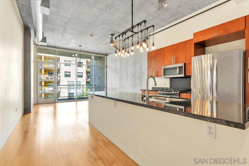 Step into the best of downtown living. This modern condo at Fahrenheit puts you steps from Petco Park, top restaurants, and vibrant nightlife. Inside, bold modern architecture sets the tone with floor-to-ceiling glass, raw concrete walls, and sleek designer finishes. The open loft style layout blends industrial edge with modern comfort. Enjoy the convenience of a secure building with dedicated parking and included Google Fiber WiFi. Bedroom is open without closed walls. Other owners with this floor plan have enclosed room to make a true 1 bedroom.