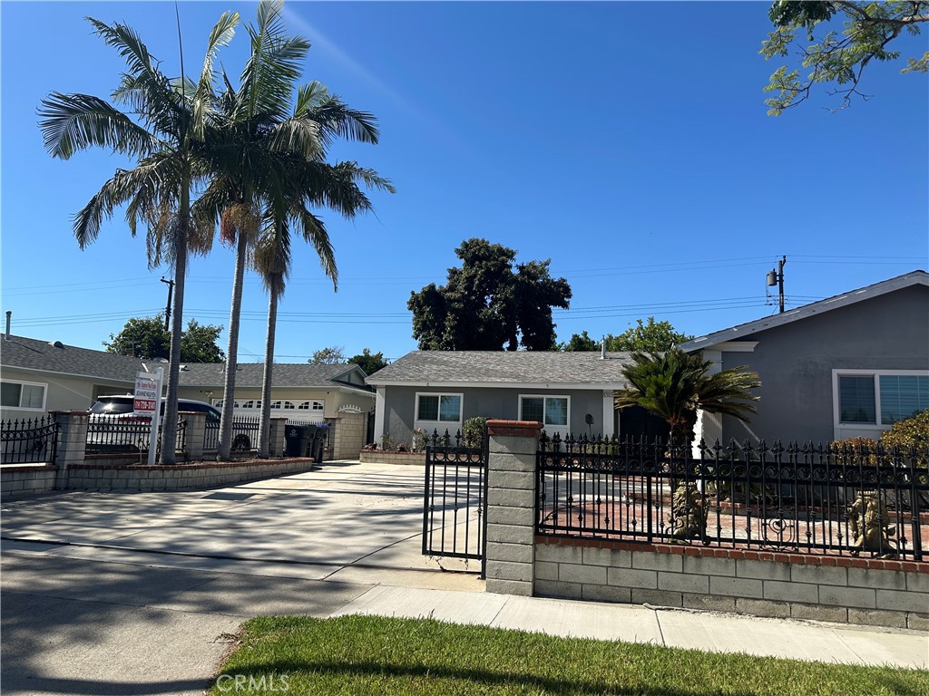 This is a NICE Location in Santa Ana! Nestled in the vibrant heart of Santa Ana, California. This 3 Beds (additional 2 bedroom added. Total 5 bedrooms) & 2.5 Baths home is next to the New Crystal Track Homes and closed to Fountain Valley, Westminster, Garden Grove. This home has Large Concrete Driveway, Brick planter in the front, 2 Car Garage access to Kitchen, and plenty of parking space on driveway. Fireplace is in the Living room, Laundry room has 1/2 bath. Master bathroom has vinyl tile. Back yard has an open patio, and with 8 x 12 toolshed & a lot of fruit trees..Block walls around back and front yard, and iron gated front. Walking distance to La Quinta High School & Mile Square Park. Easy to access to 405 & 22 fwys.