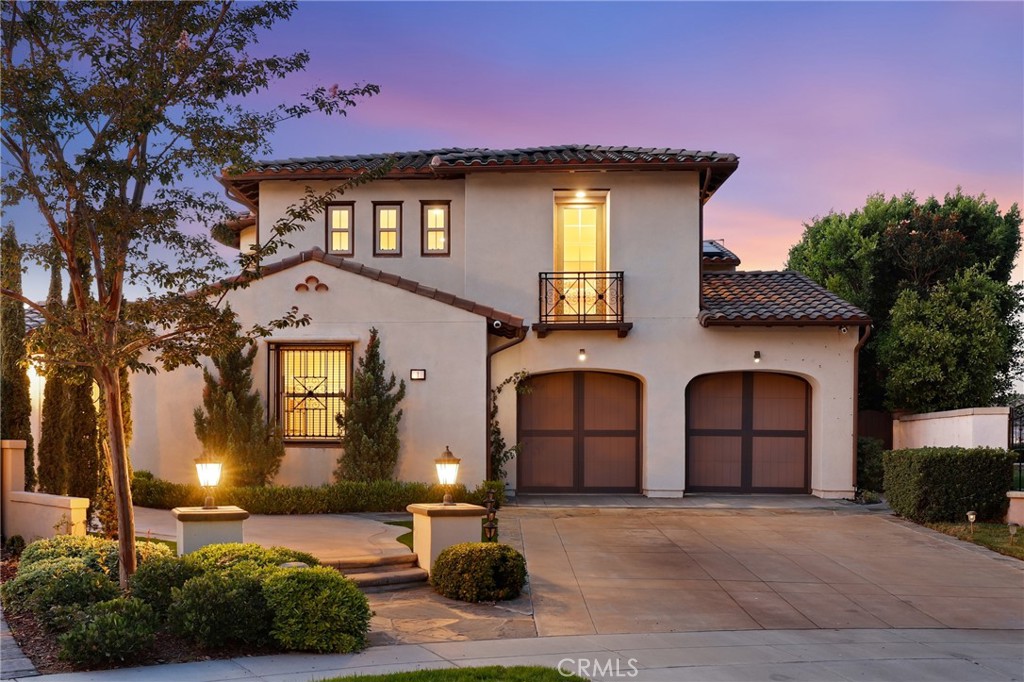 Welcome to this stunning 4 bedroom, 4.5 bath executive residence with a 3-car garage, ideally situated on an expansive 9,238 sq. ft. cul-de-sac lot in the prestigious guard-gated community of Covenant Hills. Offering 3,506 sq. ft. of beautifully designed living space, this home captures panoramic views, refreshing breezes, and the ultimate in indoor-outdoor living. The inviting private courtyard entry leads to a light-filled interior adorned with hardwood floors, custom woodwork, stone accents, and thoughtful designer details throughout. The chef’s kitchen showcases an oversized island, abundant cabinetry, and premium stainless steel appliances, complemented by Carrera-style Ceasarstone counters and a custom backsplash. Multiple sets of French doors flood the home with natural light and seamlessly connect the interior to the wraparound view lot. This highly sought-after floor plan features a spacious main-level primary suite plus an additional en-suite bedroom downstairs—perfect for multi-generational living or guests. Upstairs, an expansive bonus room anchors two more en-suite bedrooms, creating a versatile retreat for work, play, or relaxation. Step outside to your private backyard oasis designed for entertaining, complete with a cozy outdoor fireplace, large BBQ area, tranquil fountain, and an in-ground spa for evenings under the stars. A nice bonus feature is the owned solar panel system which helps with the energy costs for sure. Nestled in one of Orange County’s most desirable master-planned communities, you’ll enjoy access to award-winning schools, scenic walking paths, community pools, tennis courts, parks, playgrounds, skate and water parks, and so much more. This exceptional property combines luxury, comfort, and lifestyle—truly a home you’ll want to call your own.