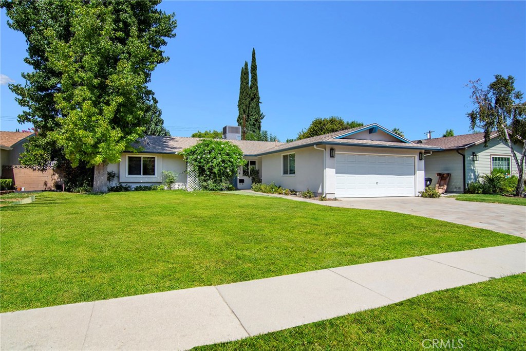 First time on the market in decades but also move in ready-- functional and super easy to move right in. This long-loved and beautifully maintained Woodland Hills single-family home is the perfect blend of charm, comfort, and location. Situated on flat, walkable streets ideal for nighttime strolls, this home offers an inviting open-concept layout with gleaming hardwood floors and updated windows that flood the space with natural light. The backyard is truly the star of the show — a serene retreat featuring a fully functioning koi pond, lush grassy areas for play and entertaining, and a shaded patio overhang for warm summer days. This rare opportunity offers great schools, a highly sought-after neighborhood, and unbeatable value in a prime Woodland Hills pocket.