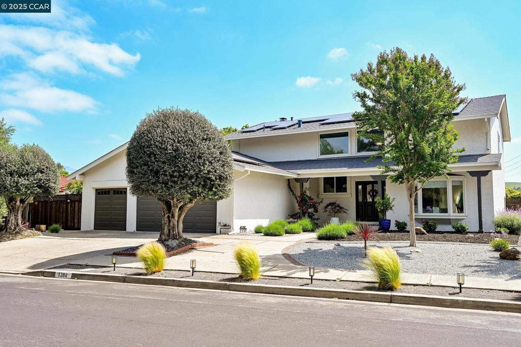 Welcome to 1394 Van Patten Dr—a stunningly redesigned home in one of Danville’s most desirable neighborhoods. Featuring 5 bedrooms, including a coveted downstairs bedroom with a full designer bath, and approximately $350K in upgrades, this home blends luxury, function, and style. The chef’s kitchen is a true showstopper, showcasing a Subzero fridge, Miele induction cooktop, Miele 7666 Fully Integrated Dishwasher, Bosch side-opening ovens, Sharp drawer microwave, ZLINE range hood, quartz counters, and a marble tile backsplash. The luxurious primary suite offers a Roman walk-in shower with rainfall head, a double vanity with brass fixtures, and a custom walk-in closet. Downstairs, the boutique-inspired guest bath impresses with statement wallpaper, an LED mirror, gold accents, and Anthropologie hardware. New 9.5" French oak floors, designer lighting, NIRA and Biolight full-spectrum fixtures, and no-VOC paint elevate the home’s healthy-living focus. Smart features include a Nest thermostat, Eufy cameras, Flume water monitor, and MyQ garage. Major upgrades—new 200A panel, EV charger, solar, insulation, roof, drought-tolerant landscaping with smart irrigation, solarium, and custom pavers—make this home efficient, sustainable, and one-of-a-kind.A true Danville gem you can't miss seeing