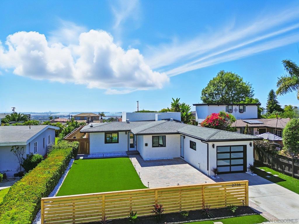 Exquisite Single-Level Bay Park Residence — Timeless Elegance Meets Modern Luxury with a rooftop deck with amazing Bay Views! Step into an impeccably remodeled sanctuary offering 3 spacious bedrooms and 2 spa-inspired baths, nestled on an expansive 6,500 sq ft lot in one of San Diego’s most coveted neighborhoods. This stunning single-story home open-concept design welcomes you with an abundance of natural light and a captivating modern fireplace that anchors the expansive living area. The gourmet chef’s kitchen is a masterpiece of design, featuring premium quartz countertops, top-of-the-line stainless steel appliances, bespoke designer lighting, and a generous island—ideal for both intimate gatherings and grand entertaining. Retreat to the serene primary suite, a private oasis boasting dual vanities, a deep soaking tub, and a sleek glass-enclosed shower, all thoughtfully crafted with upscale finishes and elegant details. Seamlessly blending indoor sophistication with outdoor tranquility, the home opens to a meticulously landscaped, fully fenced backyard with a covered patio—perfect for alfresco dining or serene relaxation. An attached one-car garage, ample driveway parking, and proximity to Mission Bay, premier shopping, and top-tier schools complete this unparalleled offering. This Bay Park gem defines refined living at its finest.