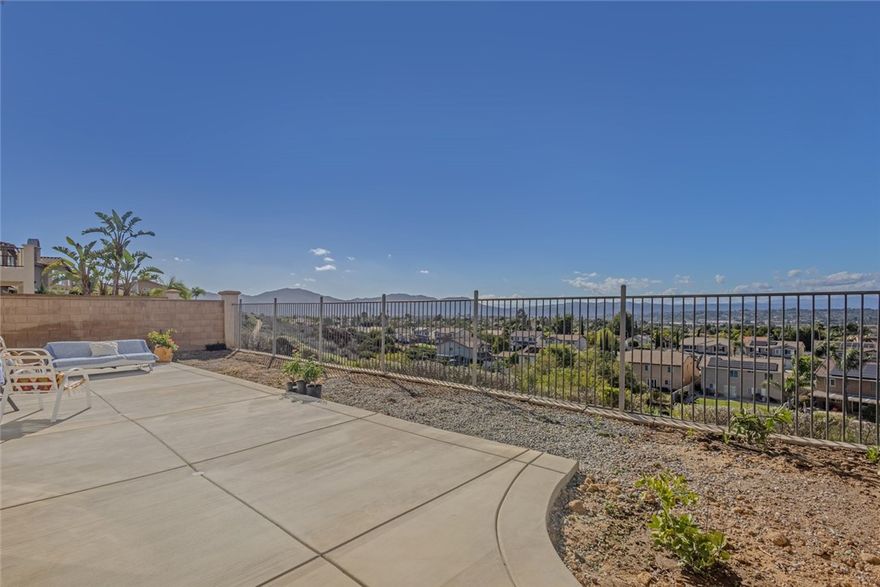 Welcome to this stunning, fully remodeled home in the highly sought-after Morgan Hill community of Temecula! Built in 2004, this home feels brand new with modern upgrades and designer finishes throughout. The spacious, open-concept floor plan features a gorgeous chef's kitchen complete with quartz countertops, custom cabinetry, new stainless steel appliances, and high-end porcelain tile flooring that flows seamlessly through the main level. The family room opens to the bright kitchen and offers an inviting space for entertaining, highlighted by a cozy fireplace and plenty of natural light. Downstairs, you'll find a bedroom and full bathroom- perfect for guests or multi-generational living. Upstairs showcases all new luxury vinyl flooring, a large loft ideal for a movie room, playroom, or a home office along with three spacious bedrooms. The primary suite offers beautiful views of the whole valley and a new remodeled bathroom featuring a stone tile shower & bathtub, new vanities and contemporary fixtures. Every bathroom in the home has been thoughtfully updated with modern touches with premium materials. Step outside to a large backyard patio with expansive views of the Temecula Valley- a perfect setting to enjoy sunrise coffee or sunset dinners. The backyard features a new concrete patio and low-maintenance landscaping, ideal for relaxing or entertaining while soaking in the views. An added bonus is the easement to the left of the home, providing extra space and privacy between you and the neighboring property. Plus, there are no homes facing directly across the street, giving this location an open and private feel.  Located in the desirable Morgan Hill community, residents enjoy resort-style amenities including a private clubhouse, swimming pools, spa, fitness center, tennis courts and walking trails. The premier neighborhood also offers social events and a welcoming family-oriented atmosphere. Zoned for award-winning Great Oak High School, Vail Ranch Middle School and Tony Tobin Elementary, this home offers both comfort & convenience. Just minutes from Temecula's world-famous wineries, Old Town Temecula and Pechanga Resort & Casino, this move-in ready home truly has it all- modern luxury, breathtaking views and an unbeatable location in one of Temecula's premier communities. Homes like this rarely come available- don't miss out on your opportunity to own in Temecula's highly sought-after Morgan Hill community!!