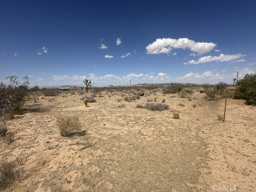 Beautiful 2.38-acre land available in the desirable North Aberdeen area, offering a peaceful and scenic setting to build your dream home. This usable lot features minimal Joshua Trees and boasts incredible 360-degree views of the surrounding desert landscape, providing a serene and quiet environment. Water is reportedly available at the street (buyer to verify with Hi-Desert Water District), and electric poles are located at the rear of the property (buyer to verify with Southern California Edison). The location is ideal for off-road and outdoor enthusiasts, with easy access to Johnson Valley, Giant Rock, and other popular destinations. Whether you're looking to develop a home, invest, or simply enjoy the open desert, this prime location offers endless possibilities. Come see it for yourself!