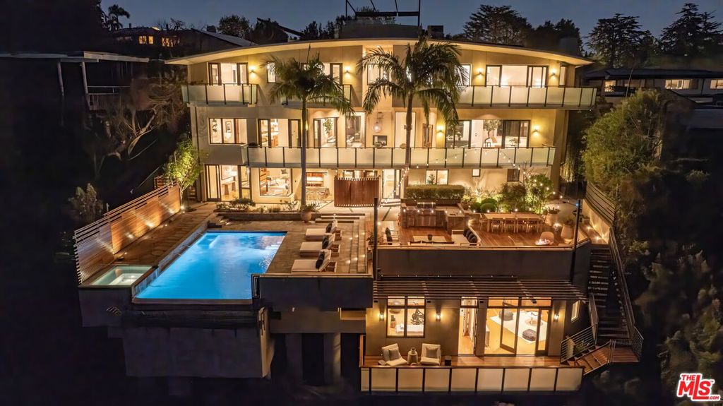 Peaceful, private and designed with exceptional care, 1535 Umeo Road in the Pacific Palisades' Upper Riviera neighborhood balances modern amenities, timeless style and unparalleled convenience. This gated, 6-bedroom/9-bath home (all ensuite plus two half baths) is steeped in serenity and boasts a resort-like ambiance. Set across 8,640SF spanning a main house and an additional guest studio 1535 Umeo Road offers versatile, expansive living space designed for gathering and connecting. This estate's one-of-a-kind views are simply without comparison. Enjoy sweeping sunsets and panoramas that encompass Will Rogers State Park, the ocean and beyond from its rooftop deck with pergola, backyard and multiple balconies. Inside, find a spacious kitchen, outfitted with top-tier Sub-Zero and Viking appliances, a 146-bottle wine fridge, and a butler's pantry. The indoor-outdoor bar area & game room is ideal for all-season social gatherings. Luxurious features also include heated floors throughout, three fireplaces, a glass elevator with a custom mural, a home theater, gym, and a 1,000-bottle wine cellar. Smart home technology enhances convenience with Lutron-controlled lighting and window treatments. The picture-perfect primary suite is also replete with a fireplace and a newly remodeled bathroom with dual Toto toilets, a steam shower, and a freestanding tub. Outside, exquisite landscaping by celebrity designer Stephen Block of Inner Gardens adds a zen-like quality to the estate, complete with fruit trees, a succulent-filled hillside, and elegant stone and teak decking. A true entertainer's paradise, this home's outdoor space includes an infinity pool and spa, outdoor shower, fire pit, sports court with pickleball and half-court basketball, and a spacious deck with built-in BBQ and fridge. A detached on-site guest suite (suited to be an art studio or office with bedroom & en-suite bathroom) offers even more versatility. The 16-camera security system, Elk alarm system & interior/exterior fire sprinklers, keep the home safe. Solar panels reduce energy costs while the RO water purification system ensures clean water throughout the property. A refined retreat in a divine location, 1535 Umeo Road pairs resort-style living with easy access to beloved local attractions and amenities. Brentwood Country Mart, Riviera Country Club & Santa Monica are all minutes away. All pictures & videos for this listing were taken on April 9, 2025