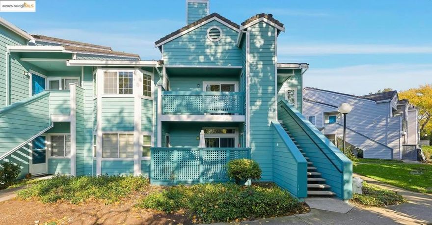 Welcome to 316 Dursey Drive — a bright, inviting upper-level corner unit in the peaceful Willowbrook community. This well-maintained 2-bedroom, 2-bath home offers 996 sq. ft. of comfortable living with abundant natural light, vaulted ceilings, and updated flooring. The spacious living room features a wood-burning fireplace and opens to a large private balcony—perfect for morning coffee or unwinding at the end of the day. The primary suite includes large bay windows overlooking lush trees, generous closet space, an ensuite bath, and direct balcony access. The kitchen includes updated hardware, luxury vinyl plank flooring, and great storage. Additional highlights include full-size in-unit laundry, updated custom cordless plantation blinds, and a detached 1-car garage with an automatic opener and keypad, plus ample guest parking. Residents enjoy access to a sparkling community pool, spa, clubhouse, fitness room, and beautifully maintained grounds. Conveniently located with easy access to parks, daily necessities, shopping, and major commuter routes, this home offers both comfort and convenience in a quiet Pinole setting.