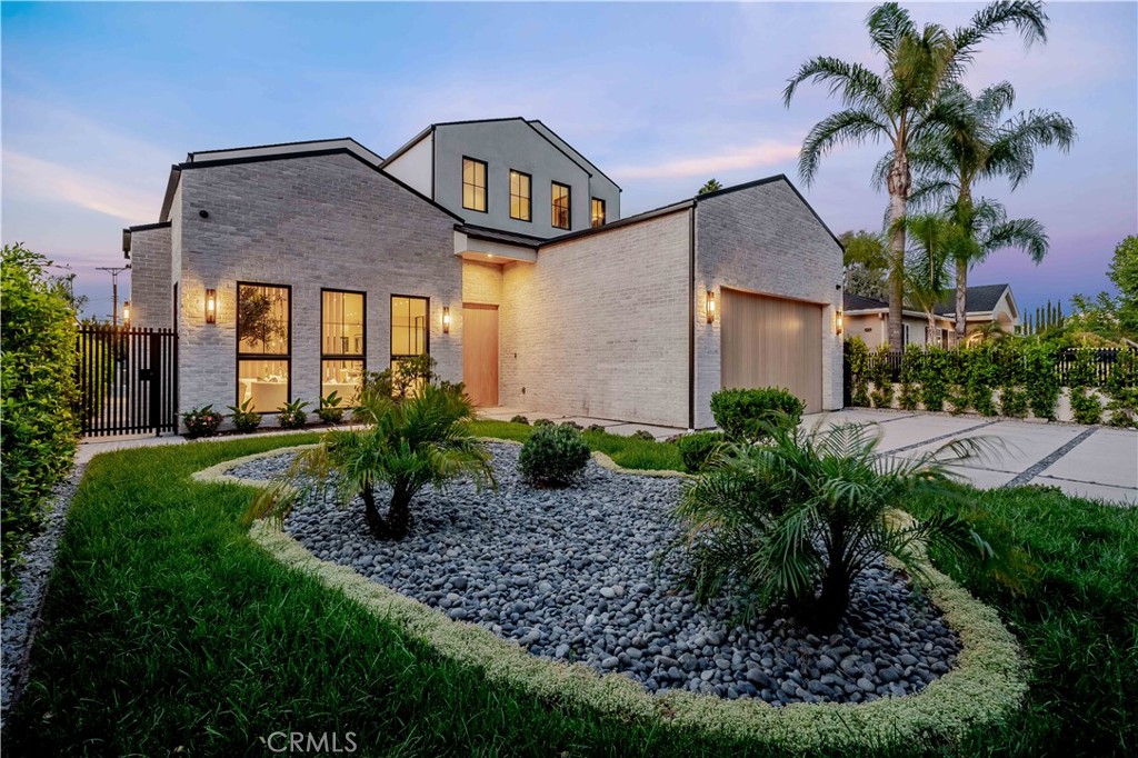 Expertly crafted from the ground up, this newly constructed modern residence offers approximately 6,458 square feet of living space, complemented by a 228-square-foot covered patio—blending architectural elegance with contemporary comfort. With six bedrooms and seven bathrooms, the home is thoughtfully designed for both grand entertaining and effortless everyday living. The first floor impresses with soaring 11-foot ceilings and a dramatic living room anchored by a floor-to-ceiling crema calacatta fireplace. Custom built-in cabinetry, and artfully designed accent walls add warmth and texture throughout, while natural light enhances the home’s refined finishes. At the heart of the home lies a chef’s kitchen appointed with Miele appliances, including double ovens, a built-in coffee system, a turbo microwave, and a double refrigerator. Taj Mahal quartz countertops, a sunlit breakfast nook, and a walk-through butler’s pantry—seamlessly connecting to the formal dining room—complete the space. Outdoors, a spacious covered patio with its own fireplace creates a welcoming setting for relaxation or evening gatherings. Just beyond, a separate BBQ station with built-in grill and outdoor refrigerator is perfectly positioned for effortless entertaining. A non-slip basketball sport court and expansive lawn provide additional recreation and leisure, while a detached ADU—complete with a living room, kitchenette, and en suite bedroom—perfect for extended guests or flexible living needs. Upstairs, four generously proportioned bedrooms each offer the comfort and privacy of en suite baths. The primary suite is a refined sanctuary, featuring a striking white Travertino fireplace, an expansive walk-in closet, dual vanities, a luxurious soaking tub, an oversized glass-enclosed shower, and a private balcony overlooking the serene grounds. A spacious upstairs laundry room enhances everyday ease. Additional features include a dedicated study, a state-of-the-art home theatre, Control4X smart home technology, home audio system and a two-car garage. Every space has been thoughtfully considered, resulting in a residence that offers both refined design and modern comfort.