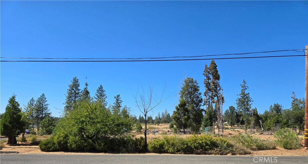 Discover this beautiful corner lot in Magalia, perfectly situated in a quiet cul-de-sac. Septic inspection has been recently done, passed and is in good condition. This property offers a well-laid-out setting with an existing driveway, plenty of mature trees, and the natural charm of a peaceful mountain community. Conveniently located near a school, Local Restaurants, the Magalia Community Center, and shopping, this lot combines both tranquility and accessibility. Whether you’re looking to build your dream home or invest in land, this property is a wonderful opportunity to be part of a growing community.