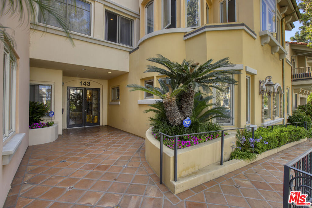 Welcome to the epitome of elegance and comfort at Beverly Hills Villas, an exquisite mediterranean condominium complex located in the vibrant city of Beverly Hills and due south of West Hollywood. Spanning 1,876 square feet, this beautifully renovated home offers 2 spacious ensuite bedrooms and 2.5 bathrooms. Step inside to discover 9 foot ceilings and a seamless blend of modern design and functionality, featuring an updated kitchen and bathrooms. The open living area is highlighted by plush luxury carpet and sophisticated travertine stone floors with detailed inset, all illuminated by recessed lighting. Casement and dual-pane windows, adorned with custom window treatments, allow natural light to cascade throughout the space. The primary ensuite is a private retreat with a gas fireplace, boasting a separate shower and spa tub, double sinks with a makeup vanity and both travertine stone and granite finishes. Relax in the soaking tub for a spa-like experience. A custom walk-in closet with custom built-ins add to the thoughtful layout of this residence.Enjoy serene moments with french doors open off two Juliet balconies, perfect for morning coffees or evening relaxation. The open layout boasts two ample living spaces for entertaining plus the dining area and open kitchen with island and breakfast bar makes this a special home for entertaining. Previously, the owners curated a music area with a baby grand piano and other instruments for musical interludes. Modern conveniences include central AC, central heating, ensuring comfort year-round. The unit features its own separate laundry room with a washer and dryer, plus storage for cleaning supplies and other utility items. Parking is effortless with elevator access, assigned side by side parking spaces, secure garage access, and guest parking available. The condo also includes private storage in the parking area, providing ample space for your belongings. Security is prioritized with an intercom and video intercom system. Access your unit effortlessly with an elevator, there is also a handicap ramp out front. Don't miss the chance to experience the best of Beverly Hills living in this remarkable condo.Amazing location. Walk take short jaunt by car to the heart of Beverly Hills, the Saban theater, world class Cedars Sinai Hospital, shopping and dining on North Robertson with direct access to West Hollywood boutiques, restaurants, designer shopping and more.