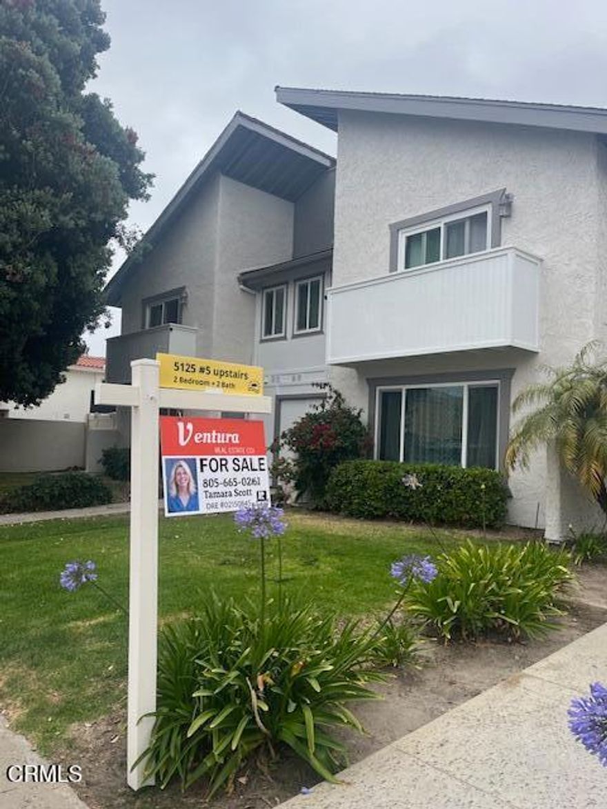 Live at the beach.  Move in ready upstairs condo.  This is steps from the beach and close to restaurants and shopping.  Open concept with light filled space.  Enjoy the patio and ocean breezes.  Make your coastal dreams a reality.