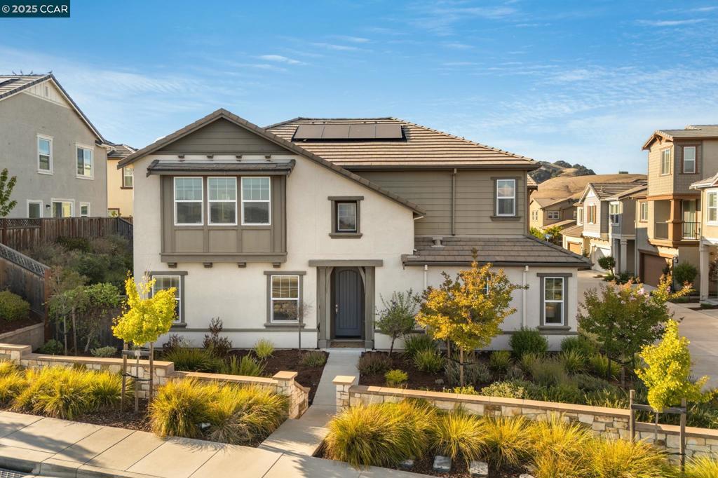 First time on the market! Nestled in San Ramon’s desirable Preserves community, this stunning corner-lot single-family home offers rare unobstructed hillside views right from your front yard. Bright, freshly painted interiors pair beautifully with gleaming hardwood floors for a warm, modern feel. The open-concept layout features a spacious living room wrapped in windows, creating a light-filled gathering space & kitchen seamlessly opening to the living area, creating an inviting space for everyday living & entertaining. A center island with bar seating & SS appliances—including a dishwasher, gas range, built-in oven & microwave—combine style and function while the adjacent dining area easily accommodates large parties. The main level is complete with a sought after bedroom&full bath. Retreat to the luxurious primary suite, where windows frame sweeping hillside & valley views, filling the room with natural light. The spa-inspired ensuite bath features dual vanities, soaking tub, walk-in shower & walk-in closet. The upper level is complete with 2 secondary bedrooms, shared hallway bath & laundry room. Take advantage of the available amenities including club house, playground, pool&more! Located within the award winning SRV school district and just a short drive to shopping/dining.