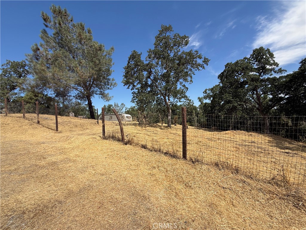 Welcome to 16318 Longhorn Ln, a picturesque 1.41-acre parcel nestled in the peaceful Rancho Tehama community, where wide open skies and the tranquility of country living set the tone for your future dream property. Whether you’re ready to build your custom ranch-style home or simply looking for a smart investment in Northern California land, this property offers the space, setting, and potential you’ve been waiting for. Set against a gently rolling landscape and framed by mature trees, this lot provides the perfect backdrop for a variety of possibilities: a spacious home, barn, garden, workshop, pool, or even your own outdoor entertaining retreat. With utilities nearby, the groundwork is in place to bring your vision to life, whether you’re building now or planning for the future. Located within the Rancho Tehama Association, you’ll enjoy access to community amenities like a neighborhood park, the future community pool (currently under construction), and the nearby Rancho Tehama Fire Department, offering both recreation and peace of mind. If you’re dreaming of a peaceful weekend escape, a self-sustaining homestead, or a quiet place to set down roots, 16318 Longhorn Ln delivers flexibility, privacy, and the charm of rural living, all within reach of Corning’s local conveniences. Come explore the land, breathe in the fresh air, and let your imagination take the lead.