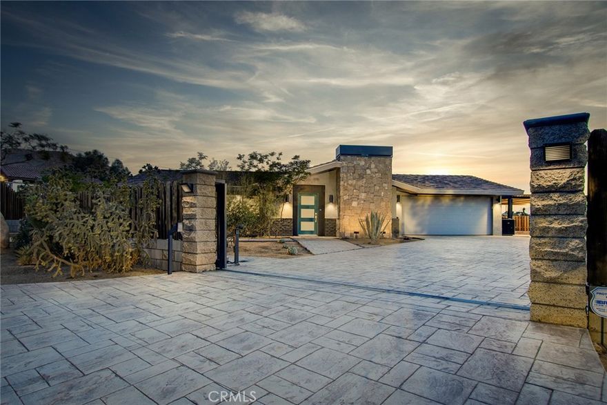 State-of-the-Art custom remodeled Home – incredible attention to detail featuring rare, exquisite craftsmanship. Interior taken down to the studs, with new surfaces inside and out, new electrical, new plumbing, new windows, doors and much more: EFFECTIVE AGE NEW. Perfect for entertaining – parking for up to 10 cars secured inside gated compound, between garage, carport and custom stamped concrete driveway. Interior features custom-made stainless steel kitchen island with double- sink, dishwasher and stovetop. Fireplace with live edge mantel. Bedrooms feature high-end open closet spaces. Hardwood flooring with 6” wide planks throughout. Step out back onto the private patio shaded by a 25’ by 25’ pavilion. Natural gas fueled fire-pit and BBQ for outdoor cooking (no propane or gas canisters). Fully fenced yard with automated gate and video intercom. EV charging station. All utilities are underground from street to house. Mature landscaping with irrigation and timed lighting. Beautiful block work. Located in Upper Friendly Hills with views of snow-capped San Gorgonio – SoCal’s tallest mountain. Additional view of the twinkling lights of the village below. Minutes to the National Park and shopping. Stunning interior and exterior work, making this a truly one-of-a-kind estate.