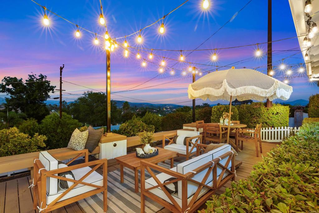 Welcome to 1529 Glenna Drive—a beautifully updated home perched on a private cul-de-sac in one of Escondido’s most desirable and historic neighborhoods. Set on a spacious .38-acre lot, this charming mid-century residence offers 1,735 square feet of interior living space plus a 470-square-foot attached deck that delivers breathtaking views of rolling hills and distant mountains. Inside, you’ll find new flooring, fresh paint, updated fixtures, and two stylishly renovated bathrooms. The home features three generous bedrooms, a large living room and separate family room, all filled with natural light and mid-century charm elevated by modern finishes. Step outside to dine al fresco on the expansive view deck—perfectly positioned to enjoy spectacular sunset vistas. The manicured front yard features lovely meandering paths that guide you through mature landscaping and lead down to your own private citrus orchard on the lower level of the lot. In back, a shaded brick courtyard offers a cozy, secluded space to relax or entertain. Additional highlights include an attached 2-car garage, off-street parking for 4+ vehicles, and septic clearance already completed for peace of mind. Conveniently located just minutes from downtown Escondido’s vibrant Grand Avenue district, with shops, restaurants, parks, and schools close by. And just three turns in your car puts you at the gates of the world-famous San Diego Zoo Safari Park. With quick access to Highways 15 and 78, the coast, downtown San Diego, and everything in between are easily within reach. This move-in-ready gem combines privacy, character, and stunning views—don’t miss the opportunity to make it your own and enjoy the best of North County living.