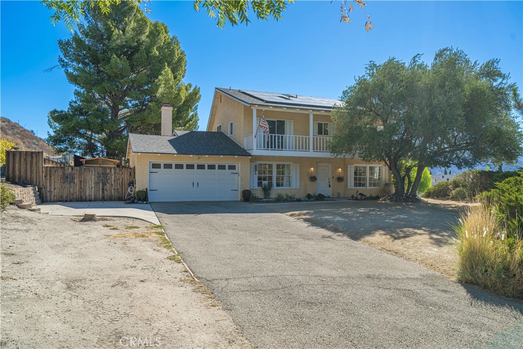 Discover this stunning spacious home offering 2,354 sq ft of comfortable living space nestled on a huge 15,197 sq ft lot. Enjoy breathtaking mountain and neighborhood views from the balconies off the master and spare bedrooms, perfect for relaxing and taking in the scenery. This versatile residence features five bedrooms and three bathrooms, including a convenient bedroom and full bathroom located downstairs, ideal for guests or family members. The large, private lot boasts RV access, a long driveway, and a beautifully large backyard with a covered patio—perfect for outdoor entertaining.
Inside, the home showcases elegant porcelain tiles throughout the downstairs area. The chef’s kitchen is a delight, featuring granite countertops, a 5-burner cooktop, and updated cabinets, making meal preparation a pleasure. The family room and living room each have cozy fireplaces with striking stacked marble stone accent walls, creating inviting spaces to gather.Upstairs, both bathrooms have been fully updated, adding a modern touch to the home. Additionally, the property includes a dedicated movie room for entertainment lovers. Conveniently located just minutes from the 14 Freeway, this home offers both privacy and accessibility. Don’t miss the opportunity to make this exquisite property your new home!