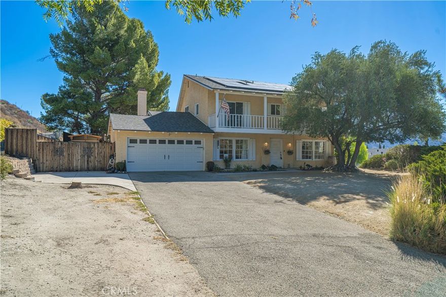 Discover this stunning spacious home offering 2,354 sq ft of comfortable living space nestled on a huge 15,197 sq ft lot. Enjoy breathtaking mountain and neighborhood views from the balconies off the master and spare bedrooms, perfect for relaxing and taking in the scenery. This versatile residence features five bedrooms and three bathrooms, including a convenient bedroom and full bathroom located downstairs, ideal for guests or family members. The large, private lot boasts RV access, a long driveway, and a beautifully large backyard with a covered patio—perfect for outdoor entertaining.

Inside, the home showcases elegant porcelain tiles throughout the downstairs area. The chef’s kitchen is a delight, featuring granite countertops, a 5-burner cooktop, and updated cabinets, making meal preparation a pleasure. The family room and living room each have cozy fireplaces with striking stacked marble stone accent walls, creating inviting spaces to gather.Upstairs, both bathrooms have been fully updated, adding a modern touch to the home. Additionally, the property includes a dedicated movie room for entertainment lovers. Conveniently located just minutes from the 14 Freeway, this home offers both privacy and accessibility. Don’t miss the opportunity to make this exquisite property your new home!