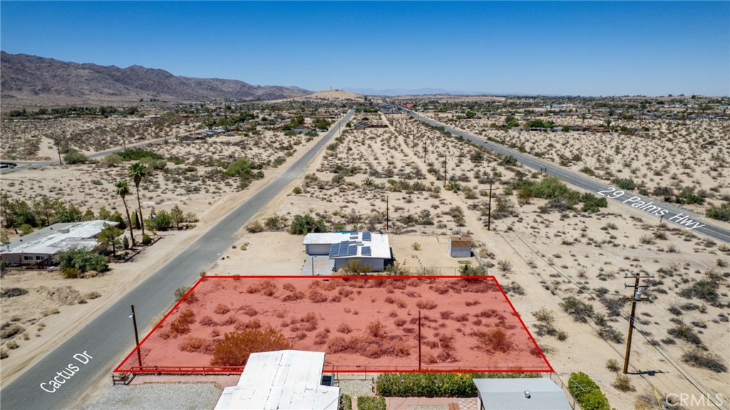 Seller Financing Available. Build your dream home, desert getaway, or income-generating vacation rental on this large, flat, buildable 0.34-acre lot in Twentynine Palms. Zoned Single Family Residential and located in an established neighborhood with successful vacation rental neighbors, this property offers nearby utilities and easy access to local amenities. Just 4 minutes (1.2 miles) from the famous Joshua Tree National Park Visitor Center, and 6 minutes to the park entrance, you’ll have quick access to world-class hiking, rock climbing, and stunning desert landscapes. For everyday needs, the property is conveniently located close to amenities. Grocery stores like Stater Bros. are 7 minutes away, downtown Twentynine Palms, with its shops, dining, and arts scene, is just an 8-minute drive, and schools like Twentynine Palms Junior High and Oasis Elementary School are within 3 to 5 minutes. Whether you’re dreaming of a personal getaway or a high-demand rental, this parcel is full of potential in one of Southern California’s most iconic desert communities. APN: 0617-201-15-0000. Address is not a real address and is for marketing purposes only. GPS: 34.135101733501415, -116.03893051253617
