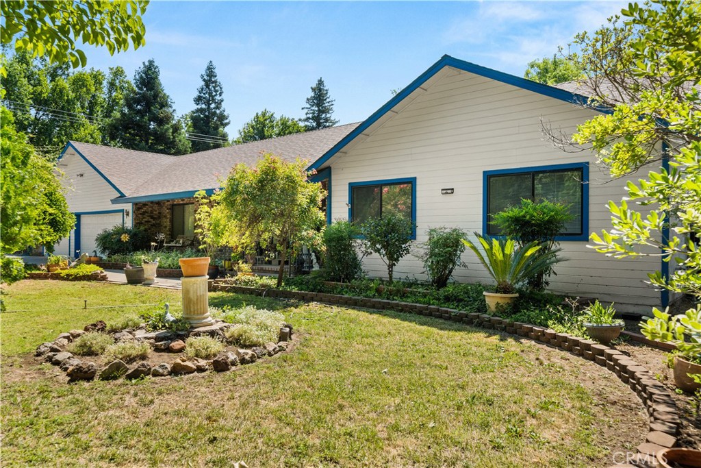 One of Chico’s most desirable neighborhoods, this spacious home offers a rare blend of privacy, usable land, and flexible living space. Featuring 4 bedrooms, 3 bathrooms, the home sits on over 1 acre of land a true gem within city limits. Step inside to a welcoming layout with multiple living areas, perfect for entertaining or multi-generational living. The kitchen offers ample counter space and storage, while the adjacent dining and family rooms create a natural flow for gatherings. Large windows throughout the home bring in beautiful natural light and views of the expansive backyard. The primary suite includes a private bath and generous closet space, while the additional bedrooms offer flexibility for guests, office space, or hobbies. With three full bathrooms, there’s room for everyone to spread out comfortably. This home sits on a corner lot with a huge 2,400 square foot finished shop with ample parking space. Oversized drive ways and private gated access to the shop.