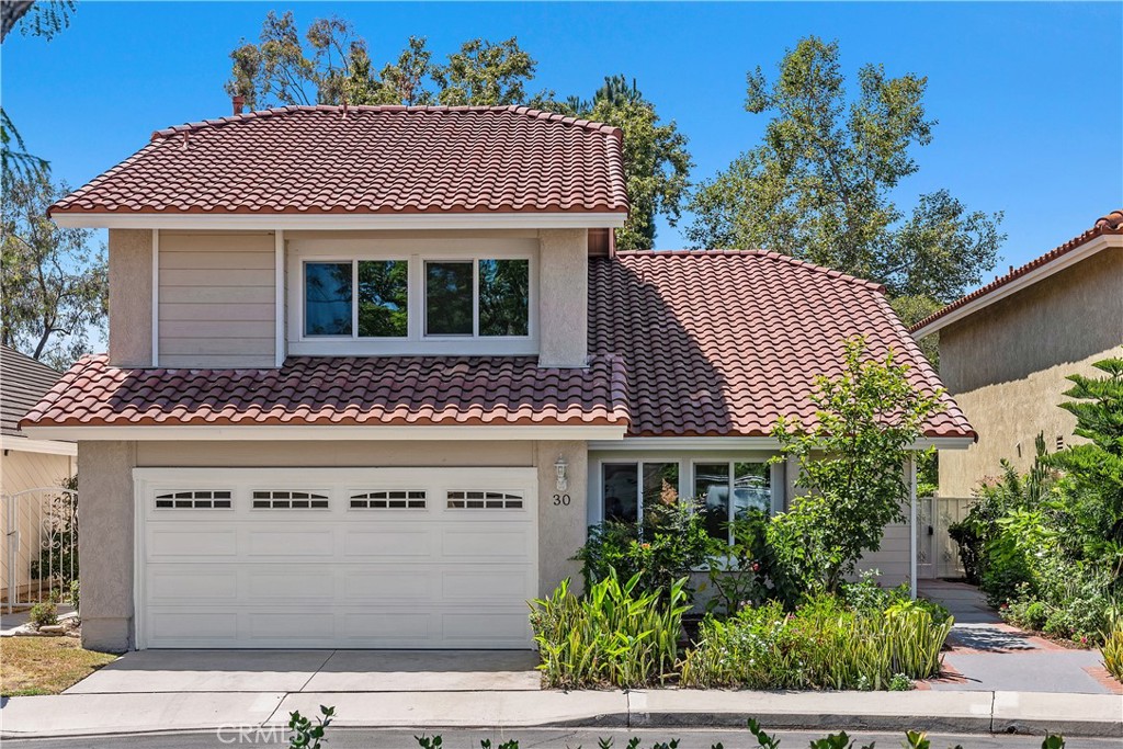 Welcome to this beautifully updated single-family home nestled in the sought after neighborhood of Park Paseo in Northwood. Enter inside to soaring vaulted ceilings and an abundance of natural light that fills the open concept living spaces, creating a warm and inviting atmosphere. This four-bed, two-and-one-half-bath Park Paseo gem offers approximately 2,350 square feet of stylish living with vaulted ceilings, remodeled kitchen and baths, brand-new windows and fresh paint inside and out. Downstairs features an ideally laid out living room with gorgeous hardwood floors that flow seamlessly. The dining room that is adjacent to the beautifully appointed kitchen opens to a pristinely manicured very private backyard. The heart of the home is a remodeled kitchen featuring sleek stainless-steel appliances, modern cabinetry and elegant countertops—great for both everyday living and entertaining. Preparing meals in your gourmet kitchen with ample counter space is a breeze with the ample cabinet space you'll find here. Guests will love being entertained as they gather in your spacious family room by the cozy fireplace. As you head up the stairs, you are greeted by high ceilings. Bright and airy primary suite features a luxurious bathroom, spacious walk-in closet, dual sinks and a step-in shower. Very spacious bedrooms with plush carpet and a guest bathroom with quartz countertops. The generously sized backyard provides a private sanctuary with lush fruit trees and ample space for outdoor dining, gardening or play. Low HOA, low taxes, no Mello Roos—plus trails, parks, shopping and dining all nearby! Enjoy resort-style amenities including two pools, a spa, tennis courts, greenbelts, BBQ areas, a clubhouse and more. With low HOA dues, low taxes, no Mello Roos and easy access to Hicks Canyon Trail, shopping, dining and parks, this home truly has it all!