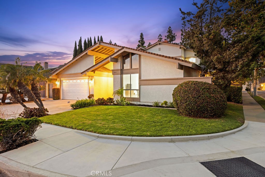 Welcome to this rare opportunity, presented to market like this for the first time! NEW stair designs PHOTOS added. Full life has been infused into this unicorn 6 bed/4 bath property, to meet the respect commanded by such an extraordinary, soaring home on a quintessential corner lot in the renowned, timeless Tustin Meadows community. Select vital updates, such as flooring, lighting and ceilings now encompass the late mid-century character well-maintained by the owner Family of over 40 years. The cure for investors picking your finishes – how about the gift of a move-in ready canvas with the chance for you to decide how to work with the charm and add your personal tastes?
This is the sought-after Plan 17 - Model D, “The Fleetwood” with notable glass providing abundant light and connection to the outdoors. Originally a three-bed/two-bath on the main level with three-bed & two-bath built on the 2nd level, but set back to not affect the high ceilings on level 1, whilst also creating an immense covered patio. The upstairs balcony features sunrise views and a bonus peek-a-boo of the Santa Ana Mountains.
Enter the neighborhood via an enchanting pine tree-lined loop. Our garden court, grand double-door entry awaits. Step inside for high vaulted ceilings adding lofty spaciousness in the living and dining rooms. Beyond, an ample & warm family kitchen with a pass-through panoramic window for entertaining and picturesque views of your brand-new backyard with citrus trees. Step out to your oversized California Room for al fresco dining and family lounging & hosting, with the new landscape serving for play and the perfect backdrop. Head upstairs for even larger rooms, including the second Primary suite and yes, it’s true - a laundry room! Second option to the downstairs laundry. Multigeneration possibilities at its finest.
Tustin Meadows is an active, master-planned community developed by R.H. Grant in 1967-69. There are 935 mid-century homes with impressive roof lines and strong curb appeal, 6 base floor plans with 4 models each. For low HOA, 2 community pools (1 Junior Olympic) and clubhouses. Plus, the 8-acre neighborhood central Centennial Park, which just REOPENED after a year-long $5M renovation! The close-knit lifestyle includes Tiny Tots preschool, babysitting co-op, Dolphins swim team, summer concerts in the park and the traditional 4th of July annual parade, 5k & Carnival in the Park celebration. Shop The Market Place and dine in Old Town Tustin!