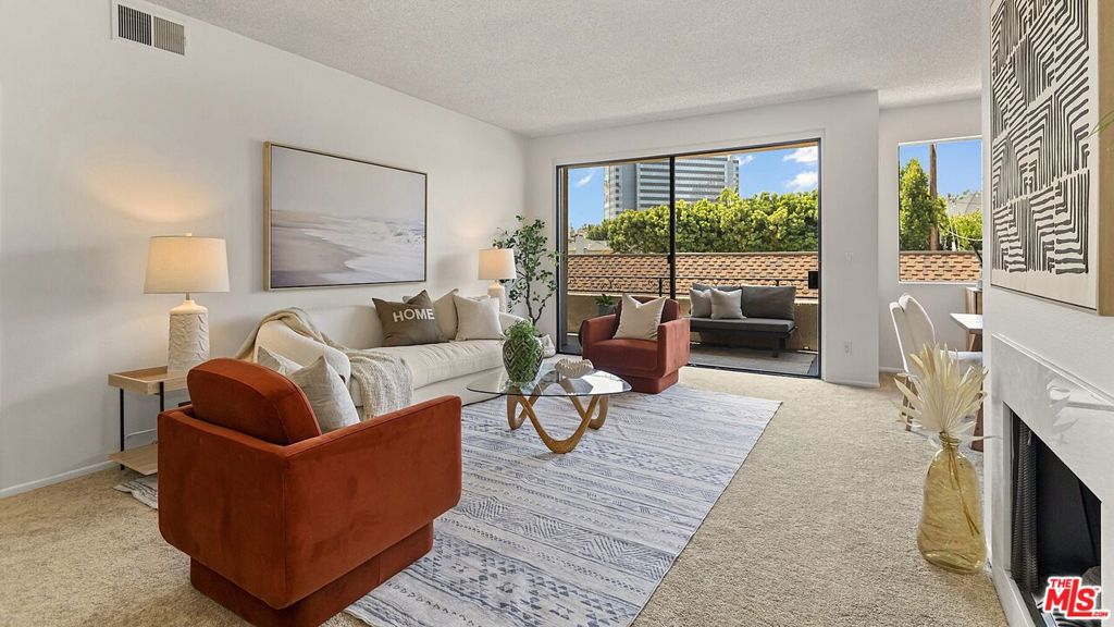 This spacious light-filled south-facing condominium is ideally located between Beverly Hills, Century City and Beverlywood - just one block south of Roxbury Park and minutes to some of LA's best shopping and dining. A double-door entry welcomes you to a well-designed home featuring a large living room with fireplace which opens to a spacious balcony with tree-top views. The formal dining area flows into the galley kitchen featuring new tile flooring, recessed lighting, newer stainless appliances, and a generous eating area. Two large bedroom suites on opposite sides of the home provide for maximum privacy. Stylishly updated baths feature new vanities, faucets, tile floors, mirrors and lighting. Roomy walk-in closets, new carpeting, large laundry room with pantry, 2 tandem parking spaces in a gated garage, and an assigned private storage closet complete this special residence. Building amenities include secure entry, renovated lobby, pool, spa, gym, and basic cable TV service. This one is a must see!