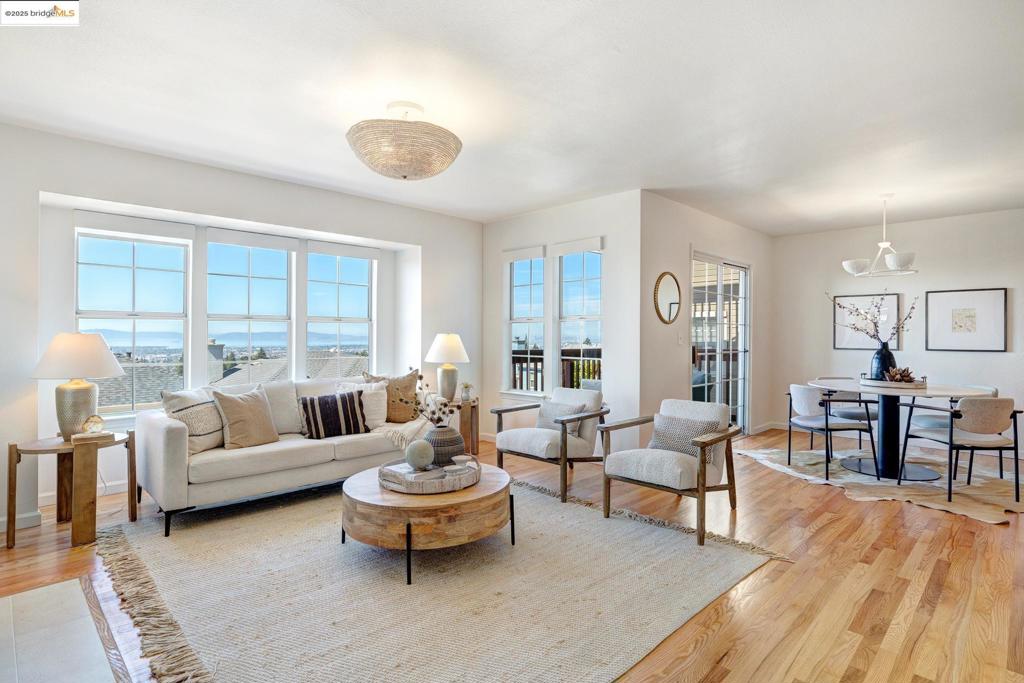 Let’s be honest—you’re probably here for that view. And we don’t blame you. The SF skyline practically winks at you from the living room and both decks of this 3BD/2.5BA hillside stunner. But stay awhile—because the layout, finishes, and functionality seal the deal. The main level features an open kitchen with solid-surface counters, pantry storage, and a styled open shelf. The dining area flows to the view deck—ideal for golden hour hangs—while the living room brings the cozy with a refreshed fireplace surround and designer lighting. A guest-ready powder room pops with wallpaper, stone-top vanity, and custom shelving. Upstairs, the primary suite has its own view deck, walk-in closet, and a chic ensuite bath with double vanity, pendant lights, walk-in shower, and private WC. Downstairs, two more bedrooms open to a stone patio—just the right size for lounging, yoga, or a sunny container garden. Bonus points: Central A/C (2020), owned solar, and a friendly 60-home community with a park and basketball court. This one checks all the boxes. Come see what living well actually looks like. Views: Downtown