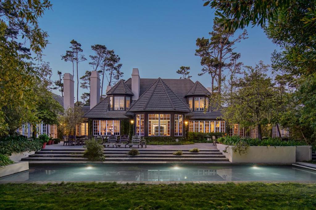 Through a discreet ivy covered front gate lies this authentic French Country estate located around the corner from The Lodge at Pebble Beach but seemingly half a world away. The tree lined gravel drive leads you to a gracious front entry with soaring ceilings, beautiful exposed beams, and a grandiose appeal tempered by the enchanting wooded setting as you peer through the French mullions. The spacious interior features 4 bedrooms, 4.5 bathrooms, and ~6200 sq ft. on the most private of 1.83 acres. Highlights include a stunning back yard with pool and multiple patios with seating, lush gardens with courtyards and meandering pathways, and a large gourmet kitchen fit for the finest chef. With plenty of space to entertain friends and family and just a few minutes walk from all the wonderful amenities the Monterey Peninsula has to offer, this timeless estate in Pebble Beach is calling for someone to come home and start enjoying.