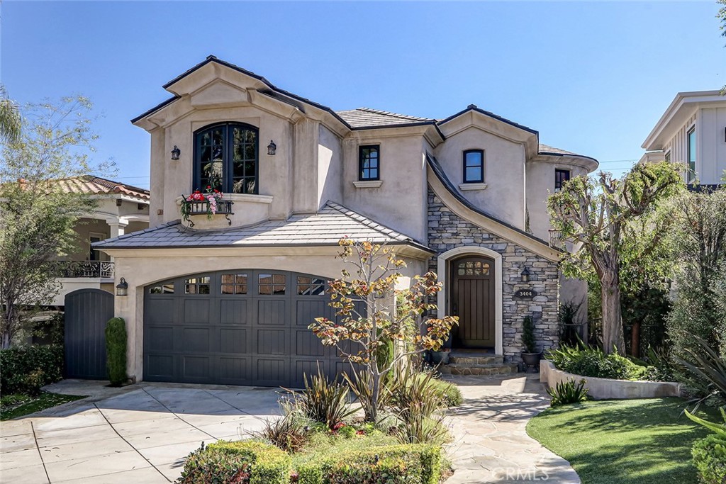 Beautiful custom French Country style home on a quiet street in the Tree Section of Manhattan Beach. Built in 2006, this 4-bedroom, 3-bathroom home offers 2855 sq. ft. of beautifully designed living space, blending clean modern lines, warm textures, and coastal charm. Floor plan includes a first floor bedroom, second-floor primary suite and two more large upstairs bedrooms, sharing a Jack-and-Jill bath. The center of the home is its large great room in back, with a huge, open kitchen opening out the family room and tidy, low-maintenance backyard. The chef's kitchen is built for gathering, featuring an oversized 12' X 5' Quartzite island with seating for six. Throughout, the home feels open and airy, with wide Brazilian Cherry flooring, super high ceilings, and natural light streaming through oversized windows. Large bi-fold doors enhance indoor-outdoor flow, opening to a private backyard with a large Pennsylvania Bluestone patio. Upstairs, the airy primary suite is a calming escape, featuring vaulted ceilings, a spa-like bath with soaking tub, dual vanities, walk-in shower, and a spacious custom closet. Additional highlights include three walk-in closets, two balconies, dual zone heating and lush landscaping. A full laundry room is also located downstairs off the kitchen. Just minutes from award-winning schools, parks, greenbelt trails, shops, and world-class beaches, this home captures the essence of modern coastal living in Manhattan Beach. UNFURNISHED rental, 13+ MONTH TERM. SMALL PETS CONSIDERED.