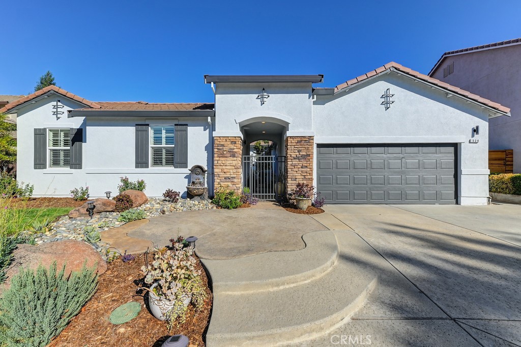 This remarkable former builder model home in Lincoln Crossing has undergone $150,000 in upgrades and features an open floor plan that is perfect for entertaining. Enjoy the benefits of living in a modern Mediterranean residence with no Mello Roos!
The spacious kitchen has been beautifully remodeled and includes a gas range, a large island, a pantry, and a cozy breakfast nook. For dining, there's a formal dining room and a separate living room/library, in addition to the expansive family room/great room. This desirable single-story layout boasts a large office with a walk-in closet, as well as three well-appointed bedrooms. All three bathrooms have also been updated.
Additional features include brand new luxury vinyl flooring, a new air conditioning system, modern light fixtures, new baseboards, and upgraded plumbing. The home also comes with owned solar panels, significantly lowering energy costs.
Step into the stunning backyard, which offers stamped concrete, a gazebo, a covered patio, a front courtyard, fruit trees, custom garden beds, and a drip irrigation system—truly a gardener's paradise ready for your enjoyment! The property also includes a 3-car tandem garage.
The homeowners' association (HOA) provides high-speed internet and grants access to the Lincoln Crossing Clubhouse, which offers amenities such as four pools, an indoor basketball court, exercise rooms, a game room, and more. Conveniently located near charming Old Town Lincoln, you'll have easy access to restaurants, shopping, schools, and other local amenities. This home truly has it all!