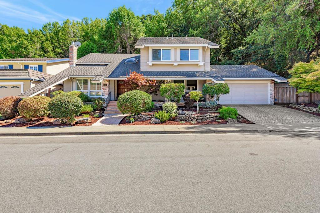 Welcome Home to 1521 Cherrywood Dr - A standout 5 bedrooms + office, 2.5 bath retreat nested in one of San Mateos most sought-after Laurelwood neighborhoods. Set on a generous ~8700 sq. ft. parcel, this 1975 built home offers ~2710 sq. ft. of thoughtfully designed living space, perfect for families and entertaining. The home welcomes you with a spacious floor plan, an elegant staircase, a sun filled living room with a fireplace and an Inviting formal dining room with sliding doors to the lush gardens. The heart of this home is a well-appointed kitchen with a majestic inviting island - a place to create memories with family and friends. The cozy family room flows directly into a large private oasis backyard. Imagine hosting a private party within a serene garden space under mature trees and a waterfall. Office conveniently located on ground level and 5 private bedrooms upstairs. Additional features include, cherrywood hardwood floors, gourmet granite countertops, custom cabinetry, stainless steel appliances, sit in kitchen, radiant flooring in the primary bath, putting green, seperate laundry room and an attached 2 car garage. This centrally located Laurelwood enclave has easy access to premium schools, shopping destinations, scenic trails, parks and major commuter routes.